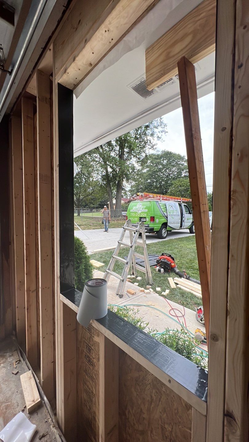 Snellville Garage Remodel Featuring Epoxy Floors and Board and Batten Siding by Swift Home Renovations