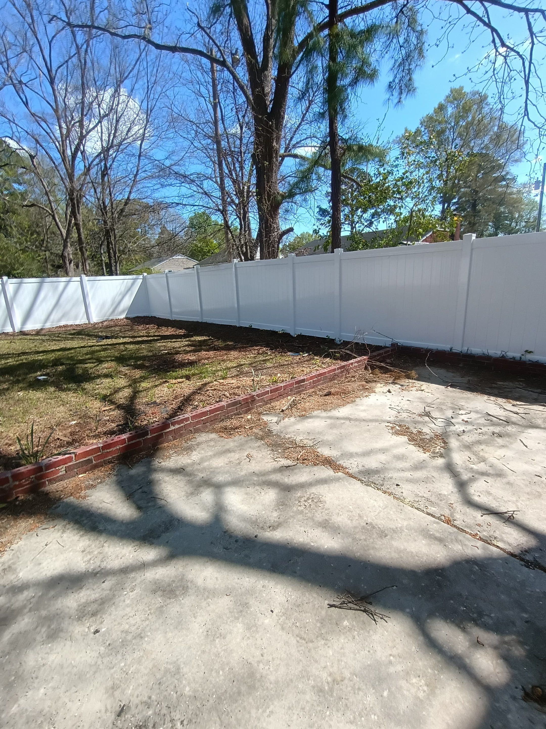 White Vinyl Privacy Fence Installation in Greenville, NC by Superior Fence and Rail