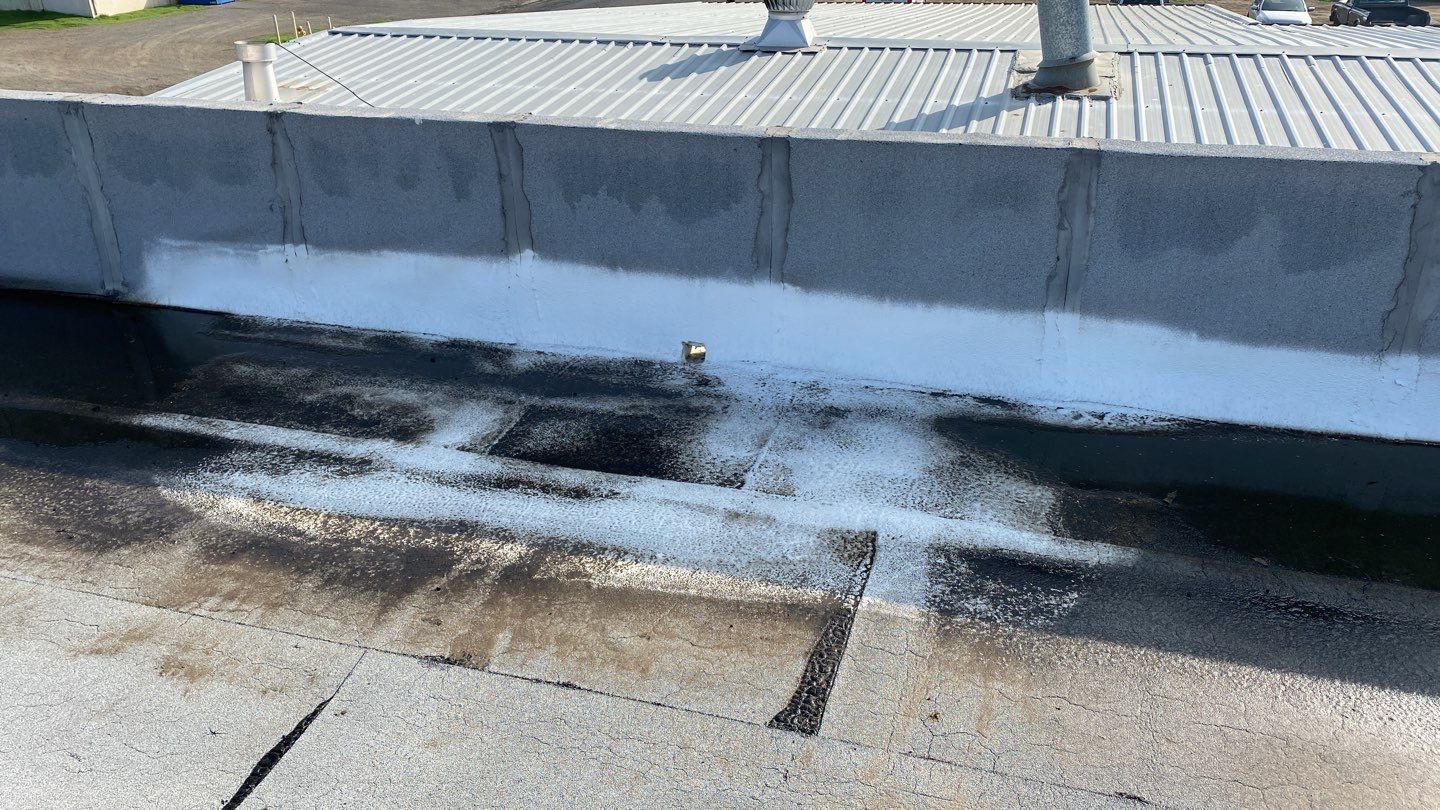 Spray foam and coatings using Conklin Benchmark/PUMA XL coatings and spray foam by Straight Edge Roofing Inc
