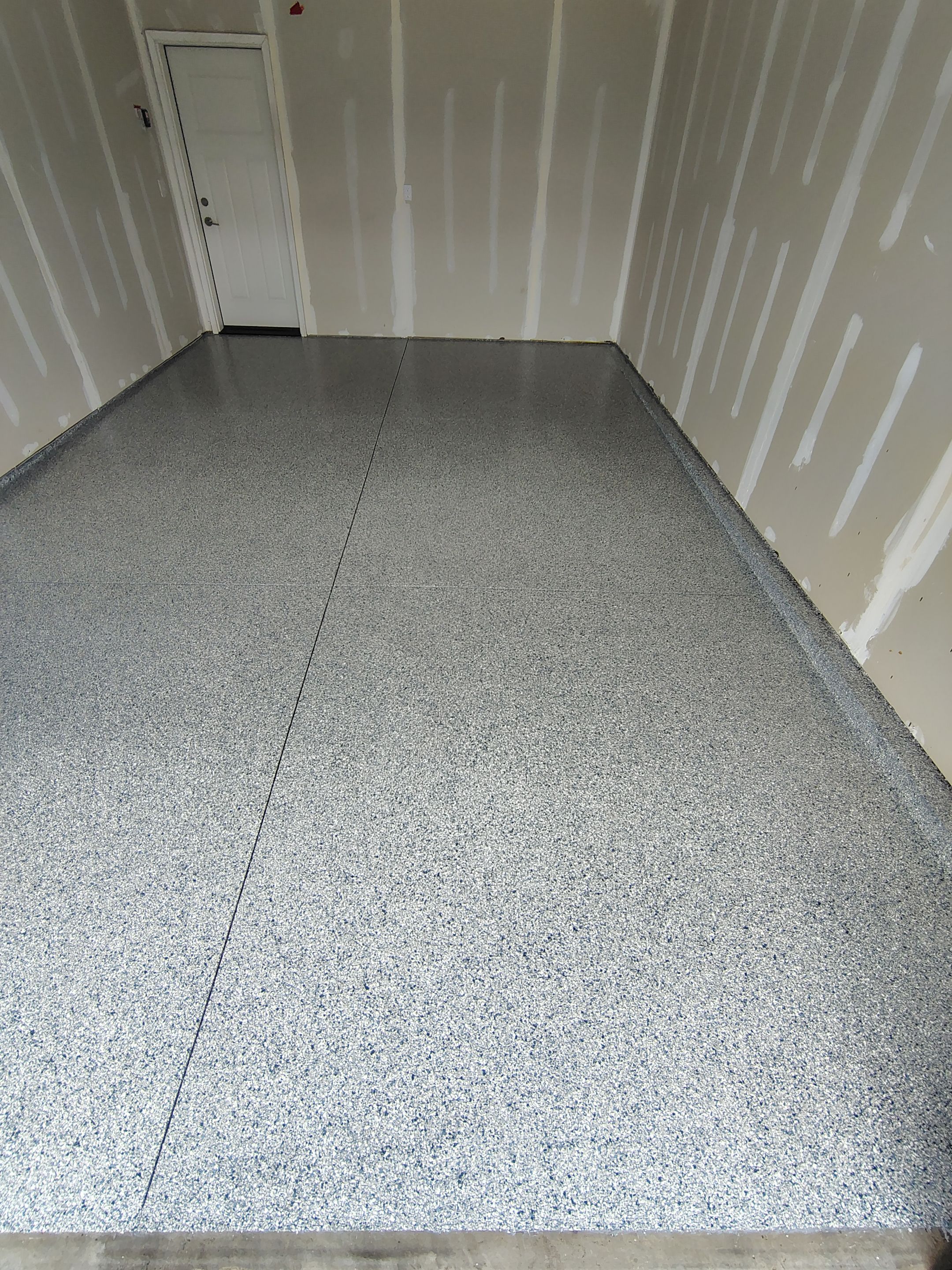 Custom Epoxy Garage Floor Coating Installation in Sioux Falls by Select Painting, Coatings & Garage Cabinets