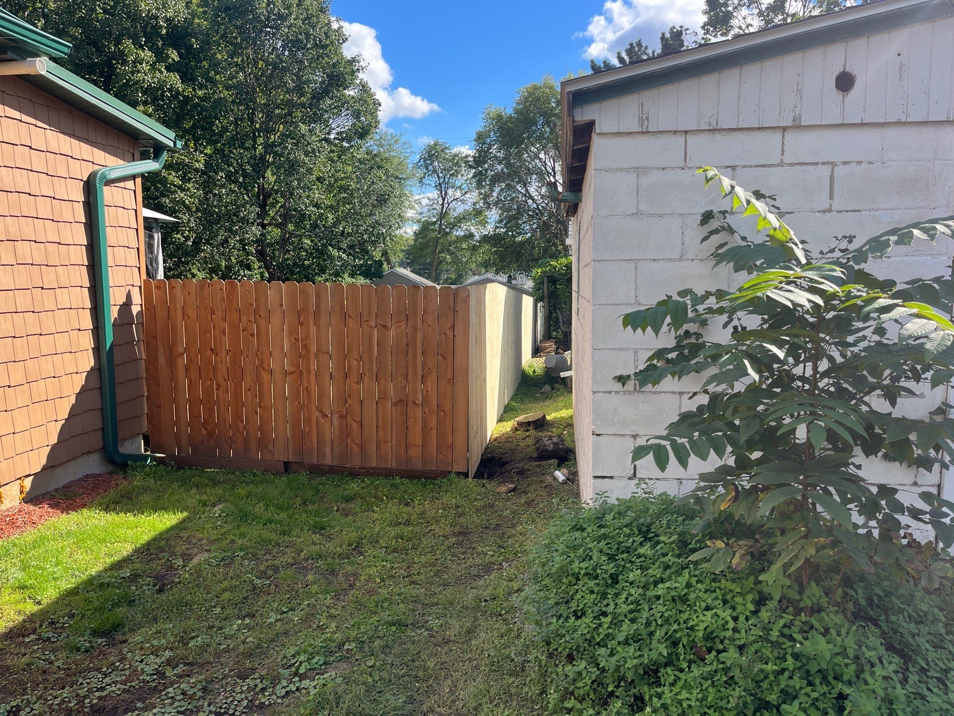 Pressure-Treated Wood Privacy Fence Installation in Waverly, Iowa by Perfect Picket Fence and Stain