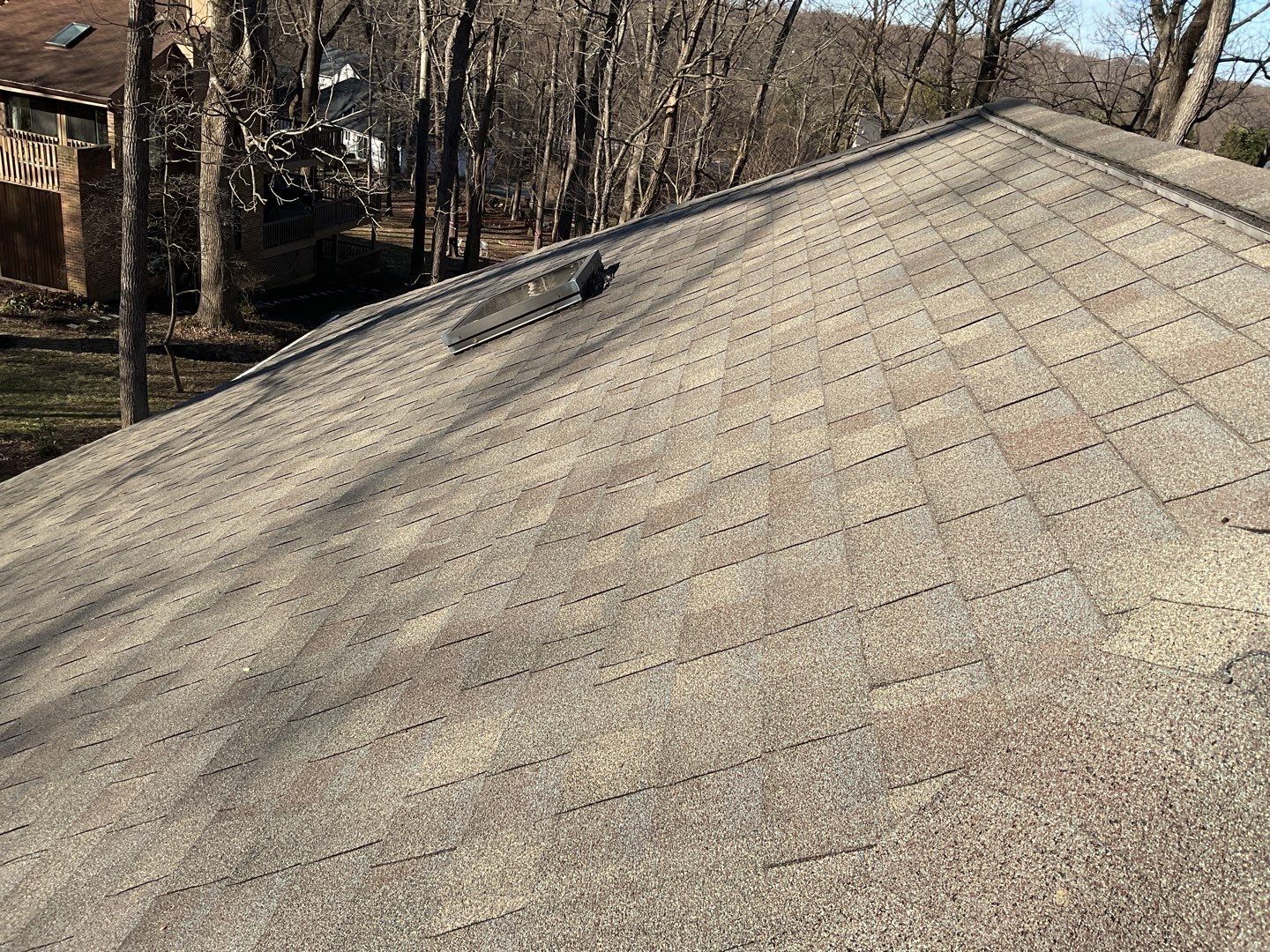 Install new shingles and new skylights  by Alpha Design Services