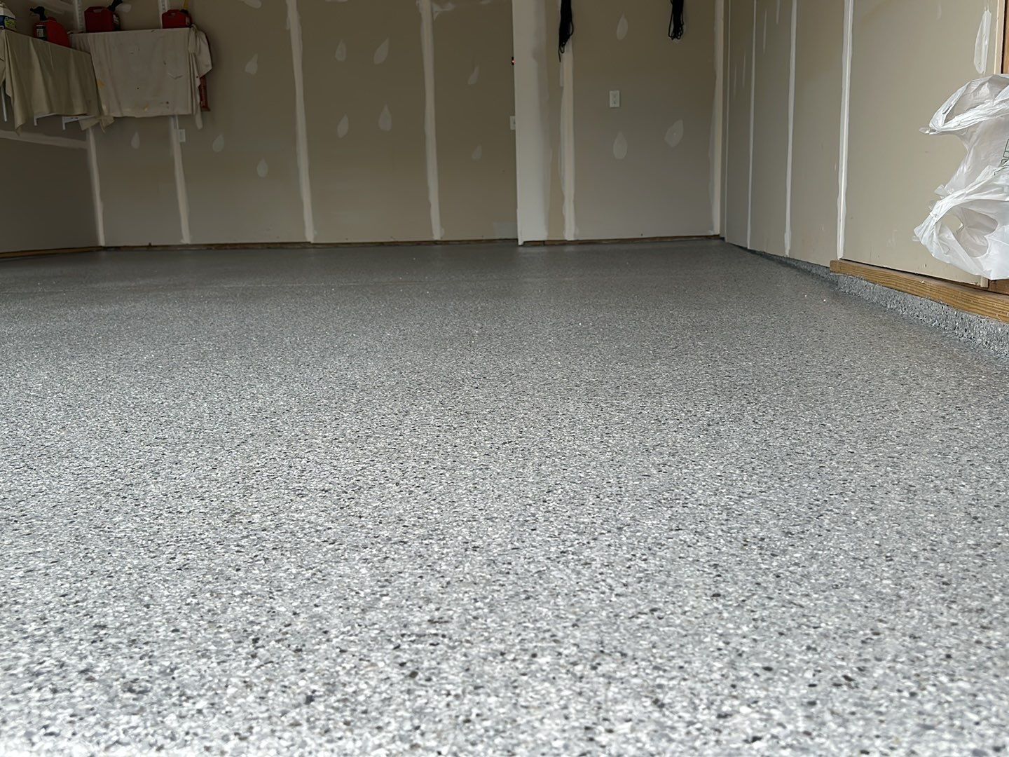 Silverado garage floor coating  by NG Masonry & Construction LLC