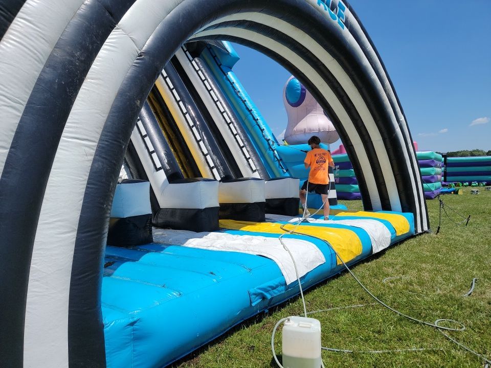 Cleaning for big bounce america prior to a large event by Northern Power Washing LLC.