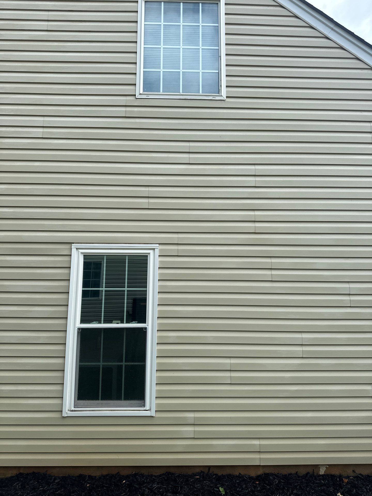 pressure washing company cleaning exterior siding of house in lancaster sc removing dirt mold and grime from surface