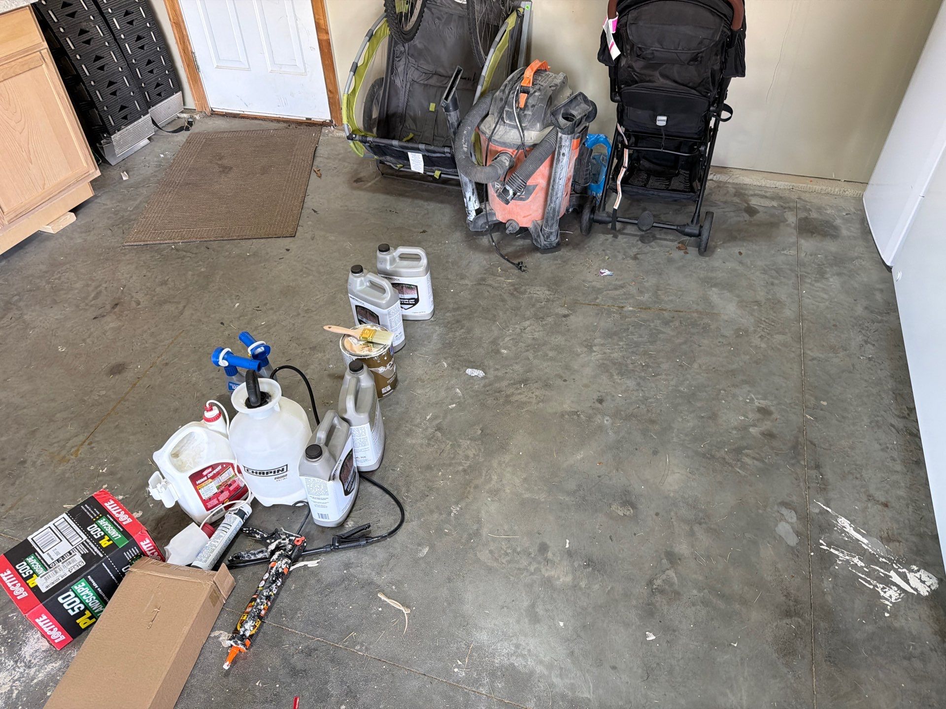 Cabin FEver Flake Garage Floor Coating Installation in Sioux Falls by Select Painting, Coatings & Garage Cabinets