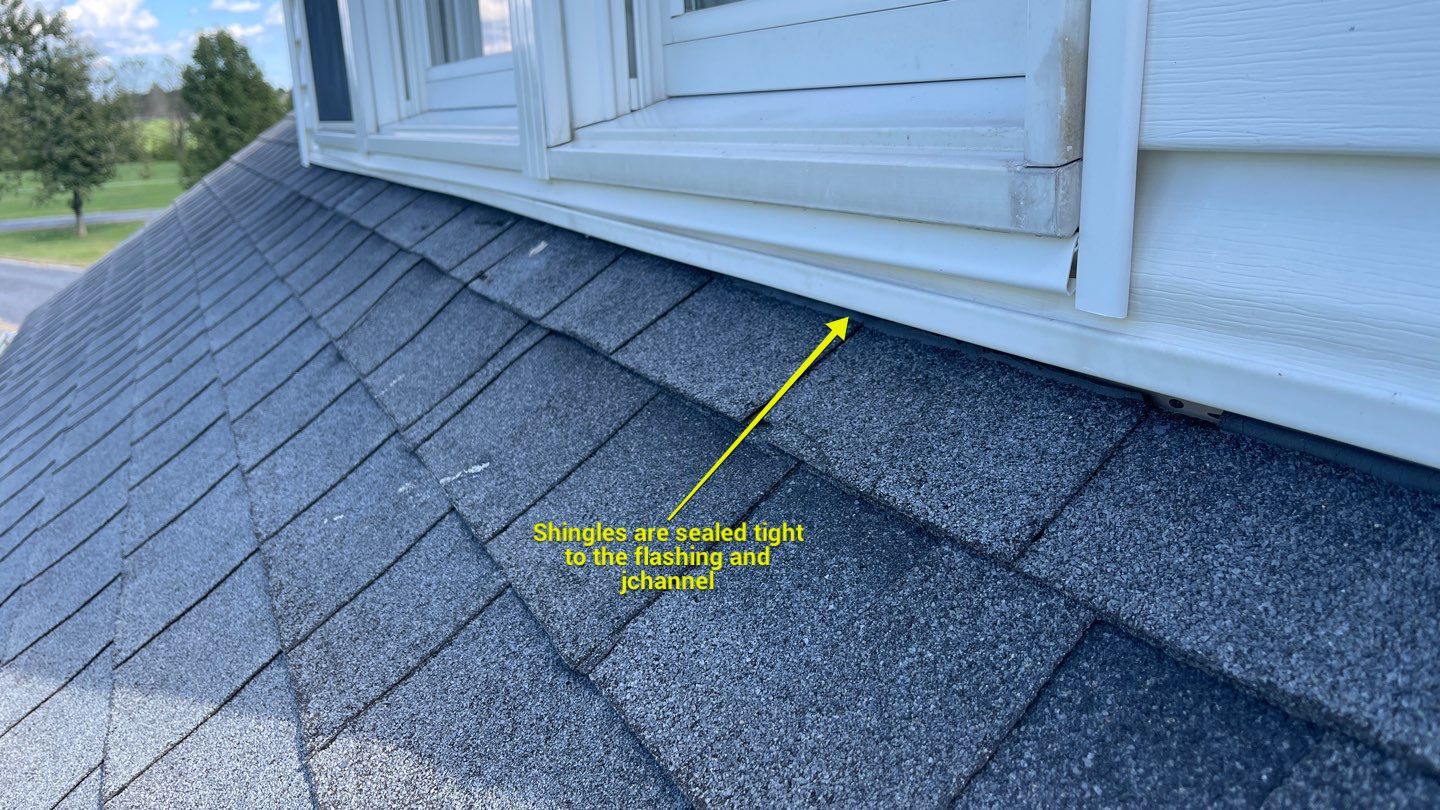 Roof Damage using Certainteed Lifetime Roofing System- Moire Black Landmark Pro shingkes with shadow ridge caps. by BulletpROOF Exteriors