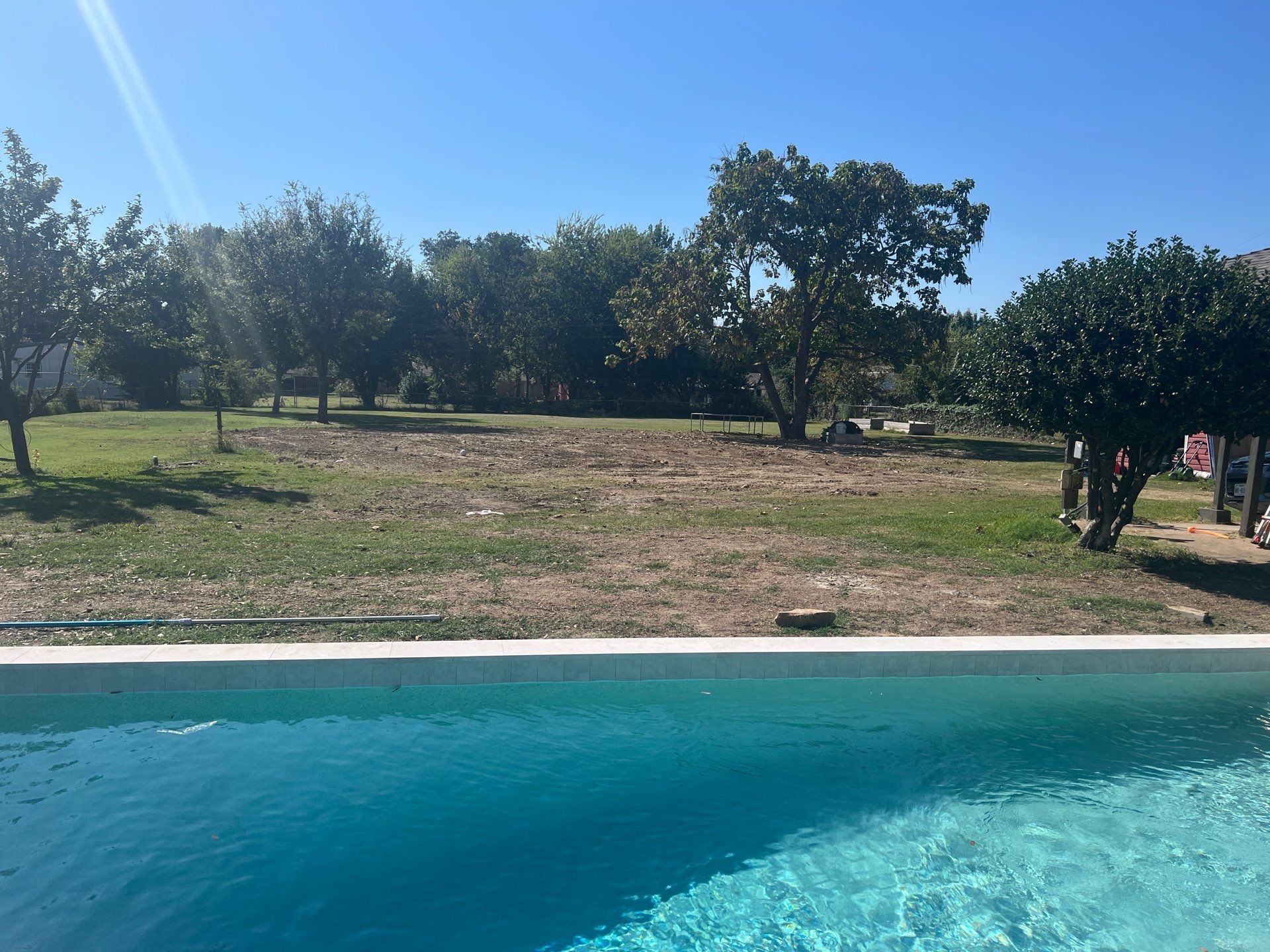 Crisp Geometric Pool with White Coping by Pinnacle Pools and Spas - DFW