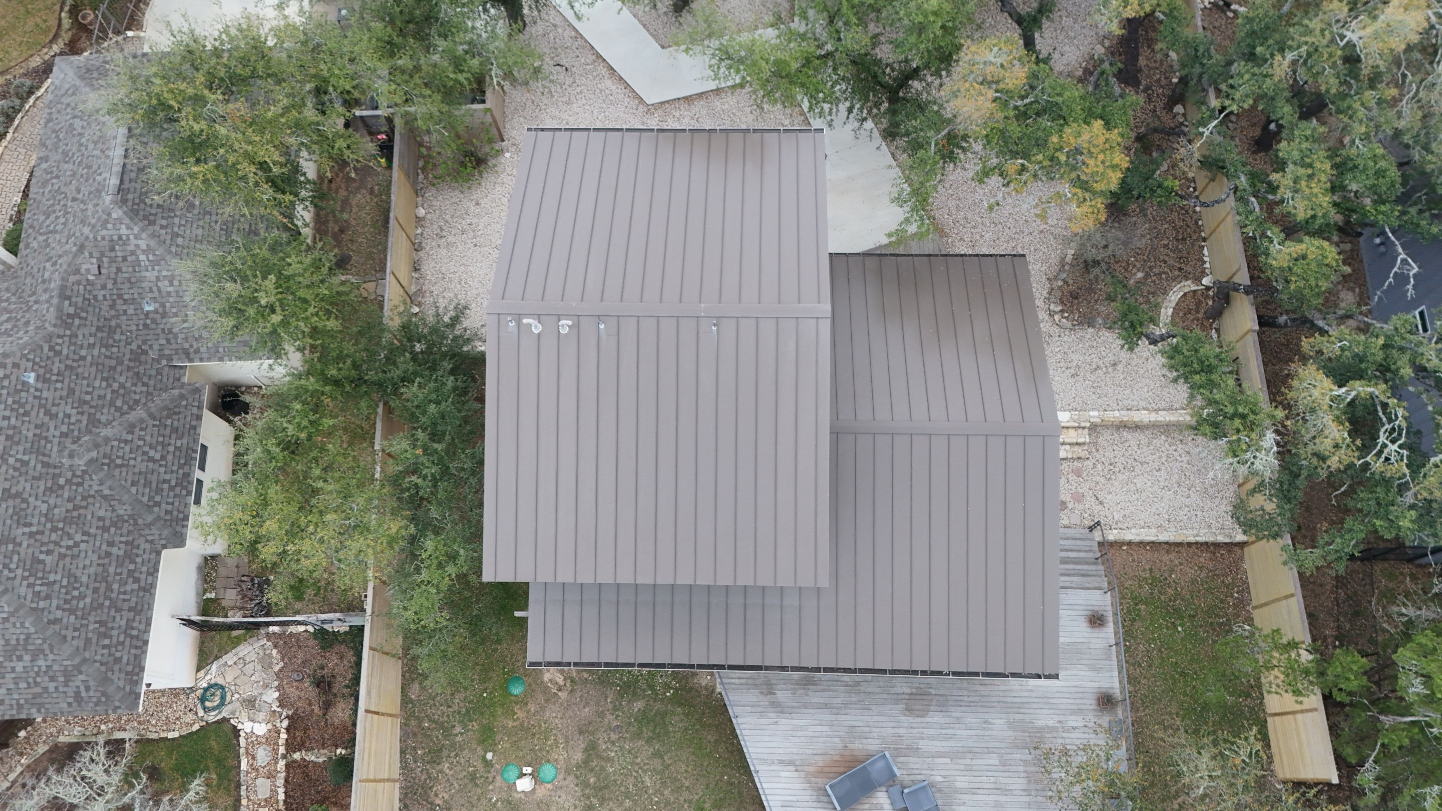 Residential Roof Replacement using 24 GA Double-Lock - Medium Bronze by Action Exteriors Austin
