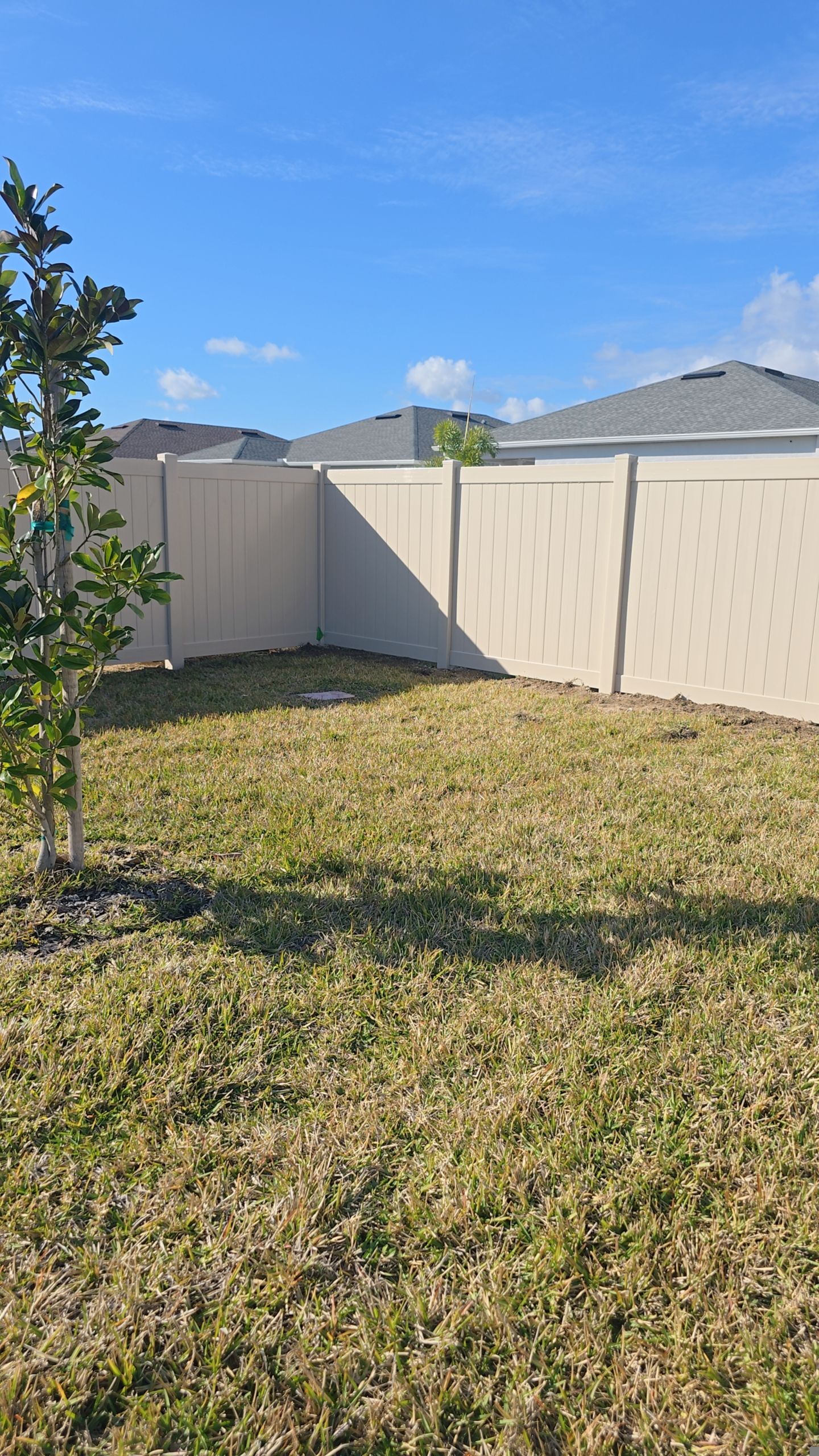 Tan Vinyl Fence in West Port by True Fence LLC