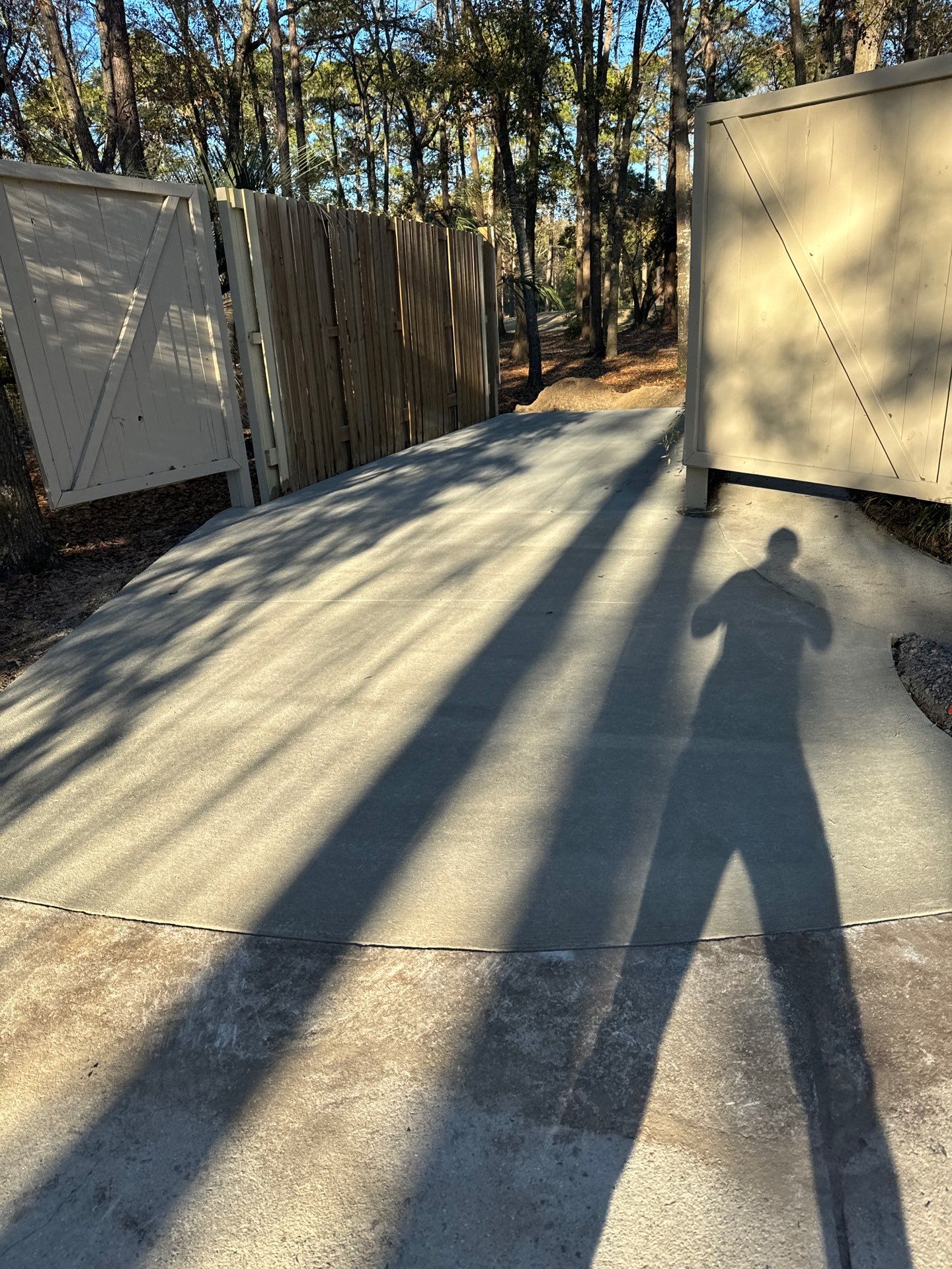 New Concrete Driveway and Privacy Fence Installation in Bluffton by Lowcountry Scapes, LLC