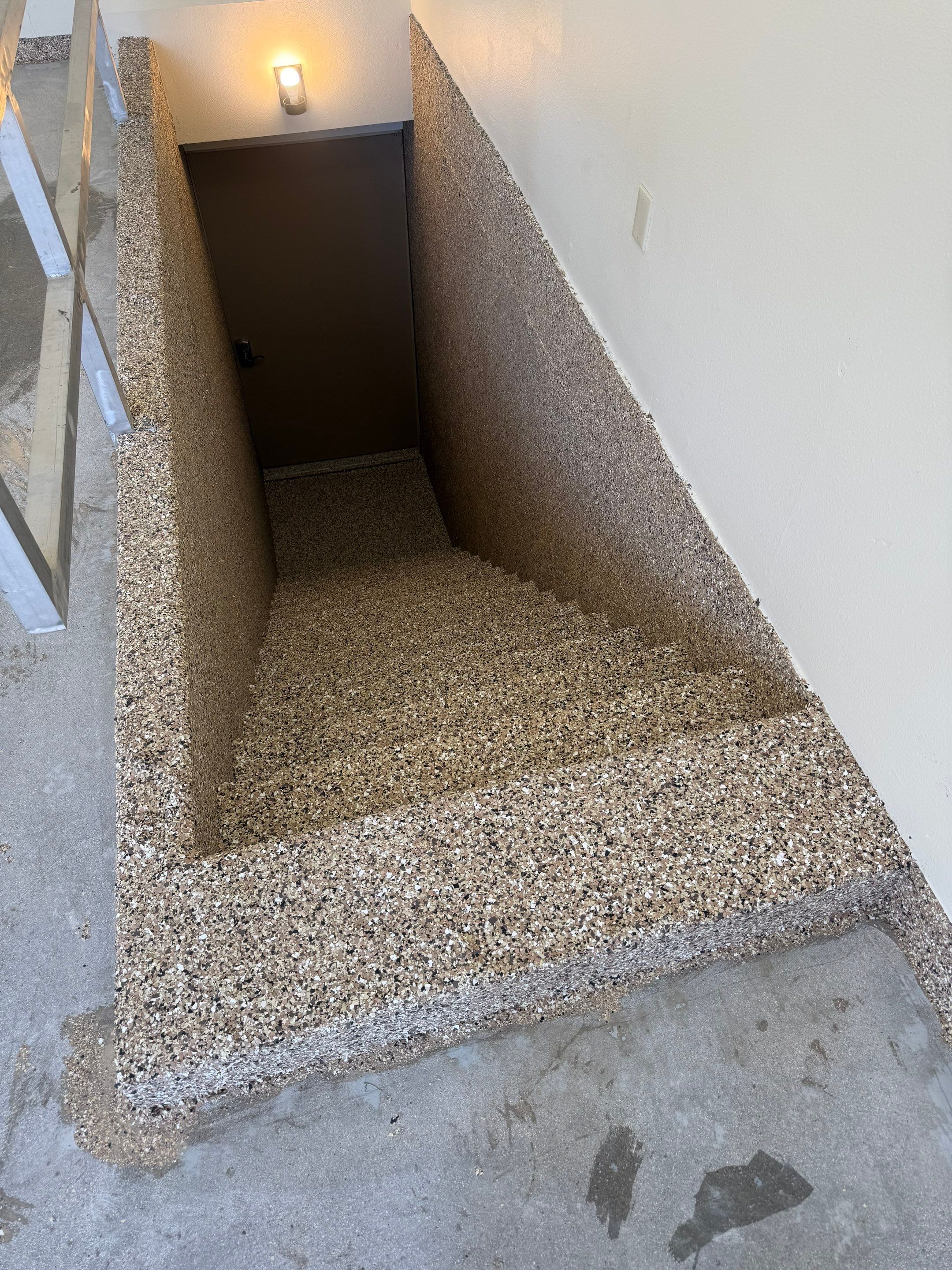 Custom Polyaspartic Garage Floor and Stairwell Coating in Pipestone by Select Painting, Coatings & Garage Cabinets