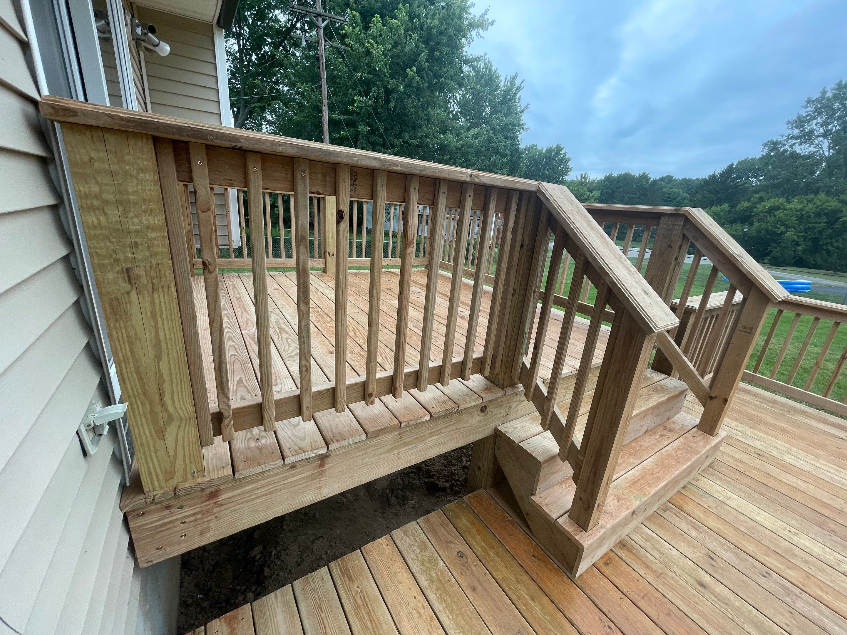 Deck Installation using Treated Lumber by Avalon Roofing and Exteriors