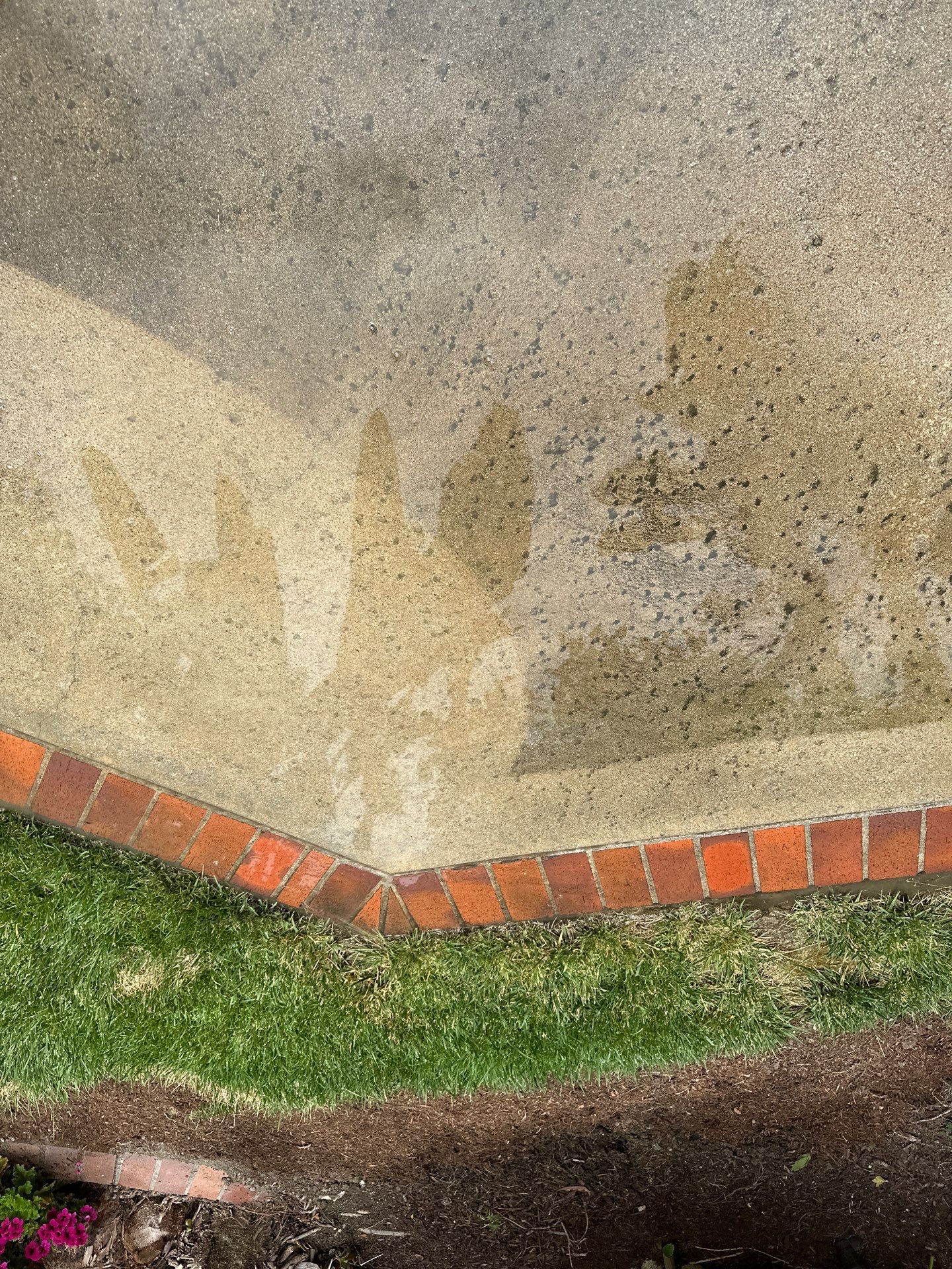 Surface cleaning pressure washing in Orange County on patio, walkways, and driveway by Property Cleaning Experts, LLC