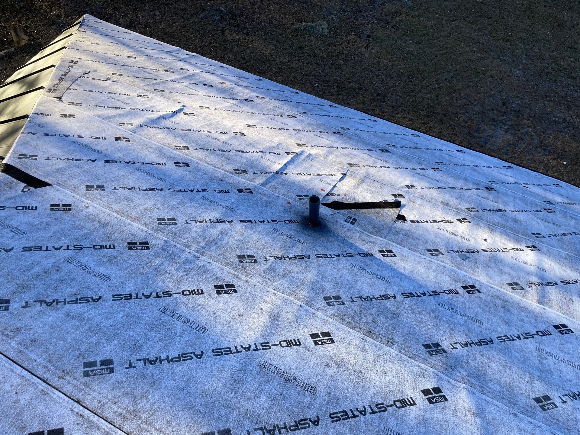 Residential Roofing Installation using Benton 26Ga 1inc Snapcock Metal Roof KYNAR Matte Black by Talya Roofing