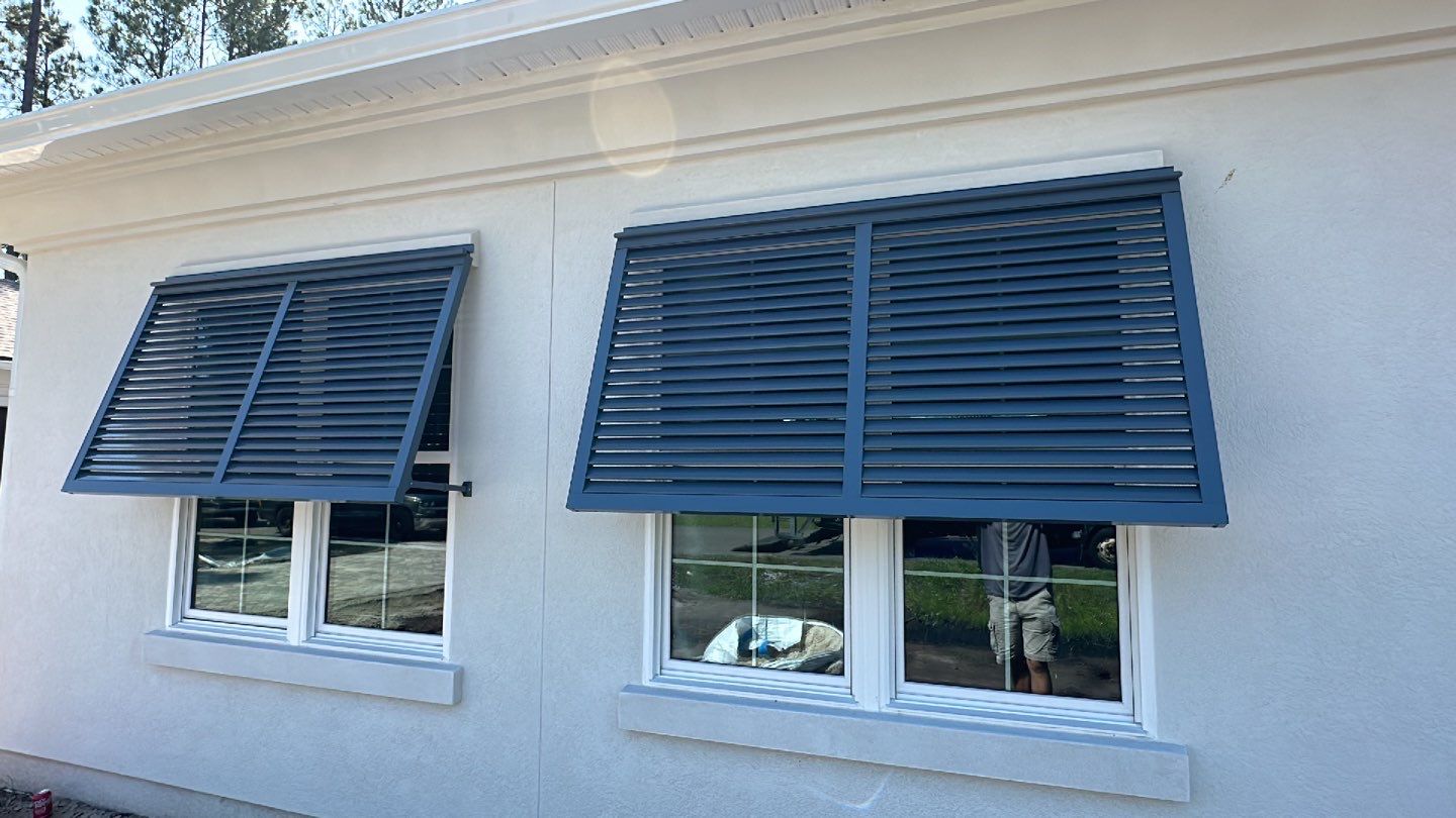 Bahama Shutters in Blue Grey  by Smart Guard Shutters