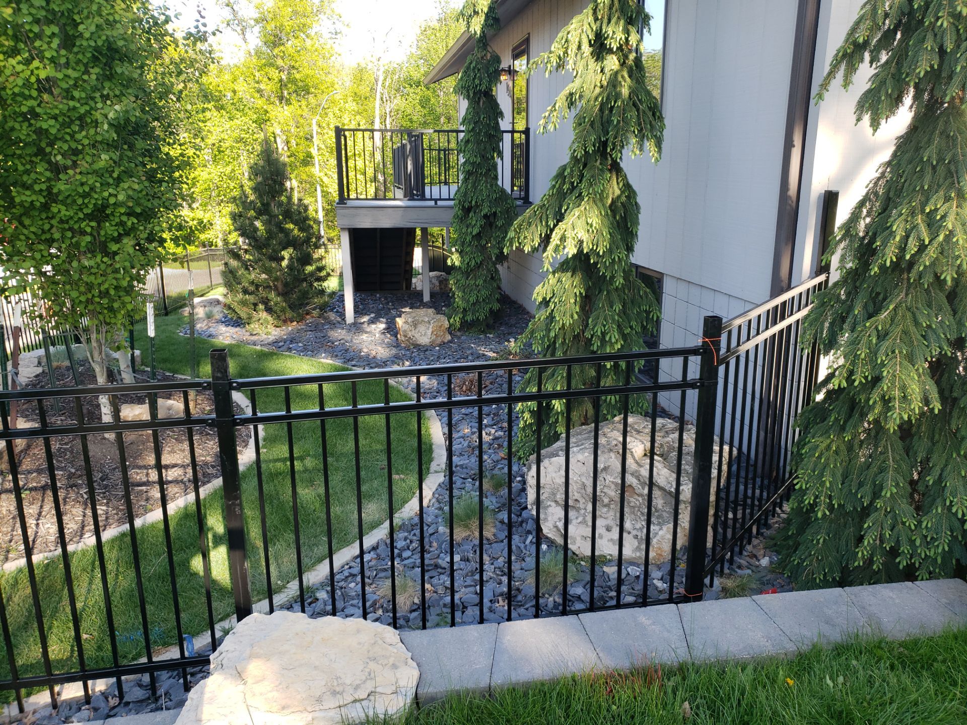 Ornamental Black Metal Picket Fence Installation in Cedar Falls by Perfect Picket Fence and Stain