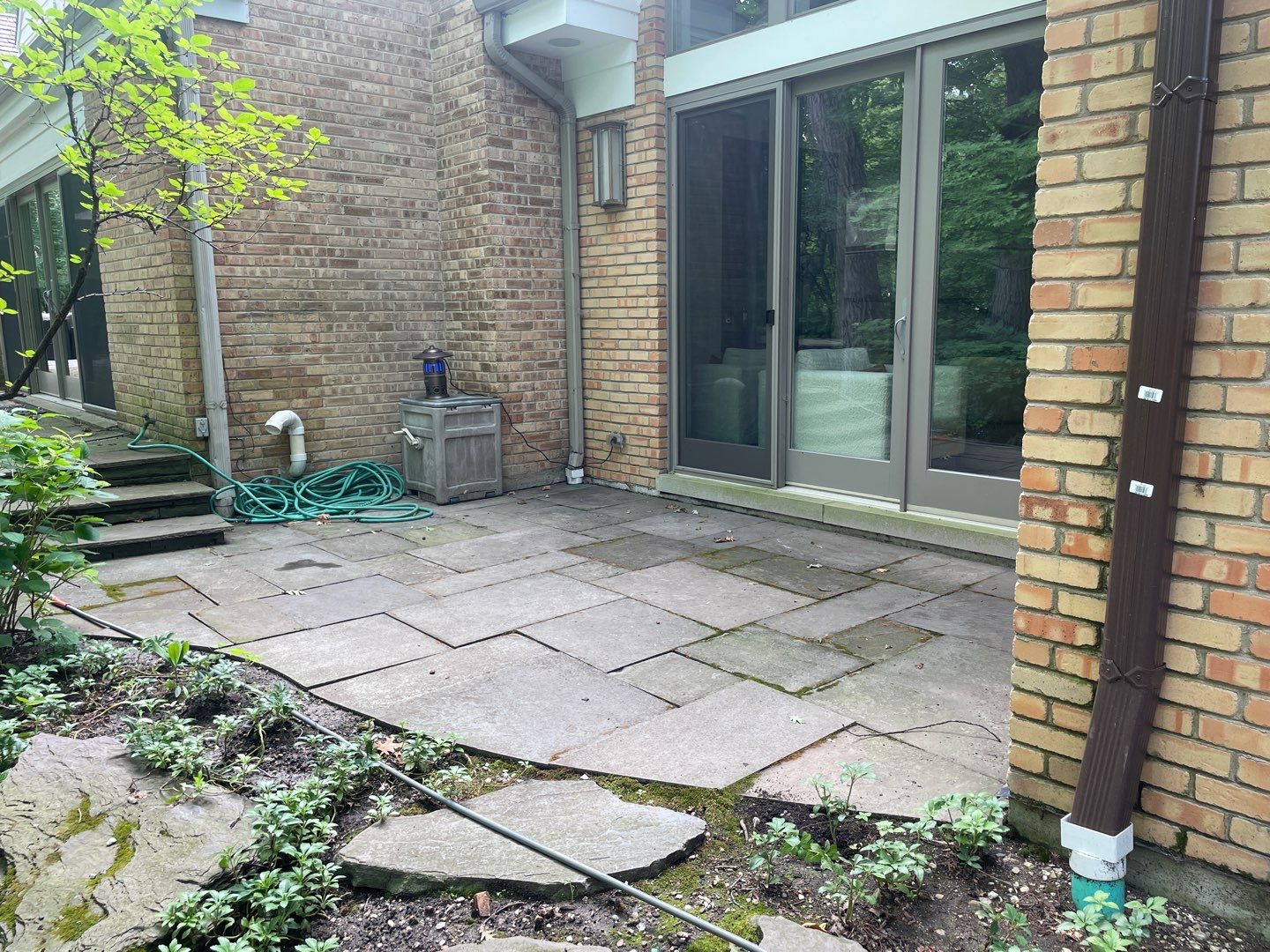 Bluestone patio cleaning by Northern Power Washing LLC.