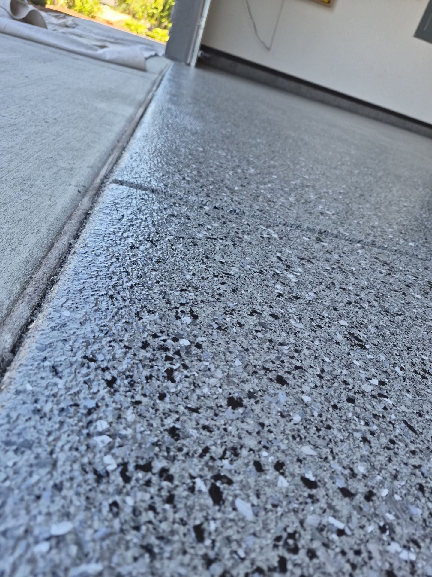 Polyurea Garage Floor Transformation with Slate Hybrid Finish in Post Falls by Croc Coatings, LLC