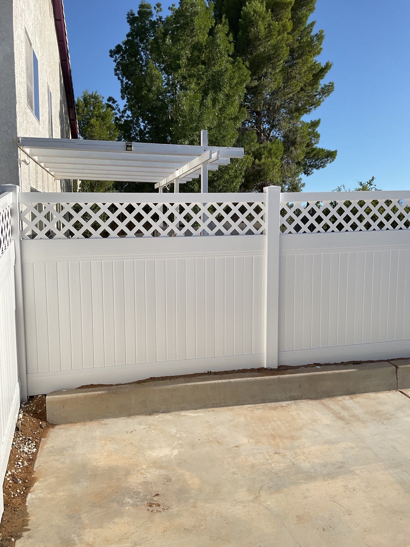 Lattice Vinyl with Privacy Vinyl Fence by Fence Guys Inc.