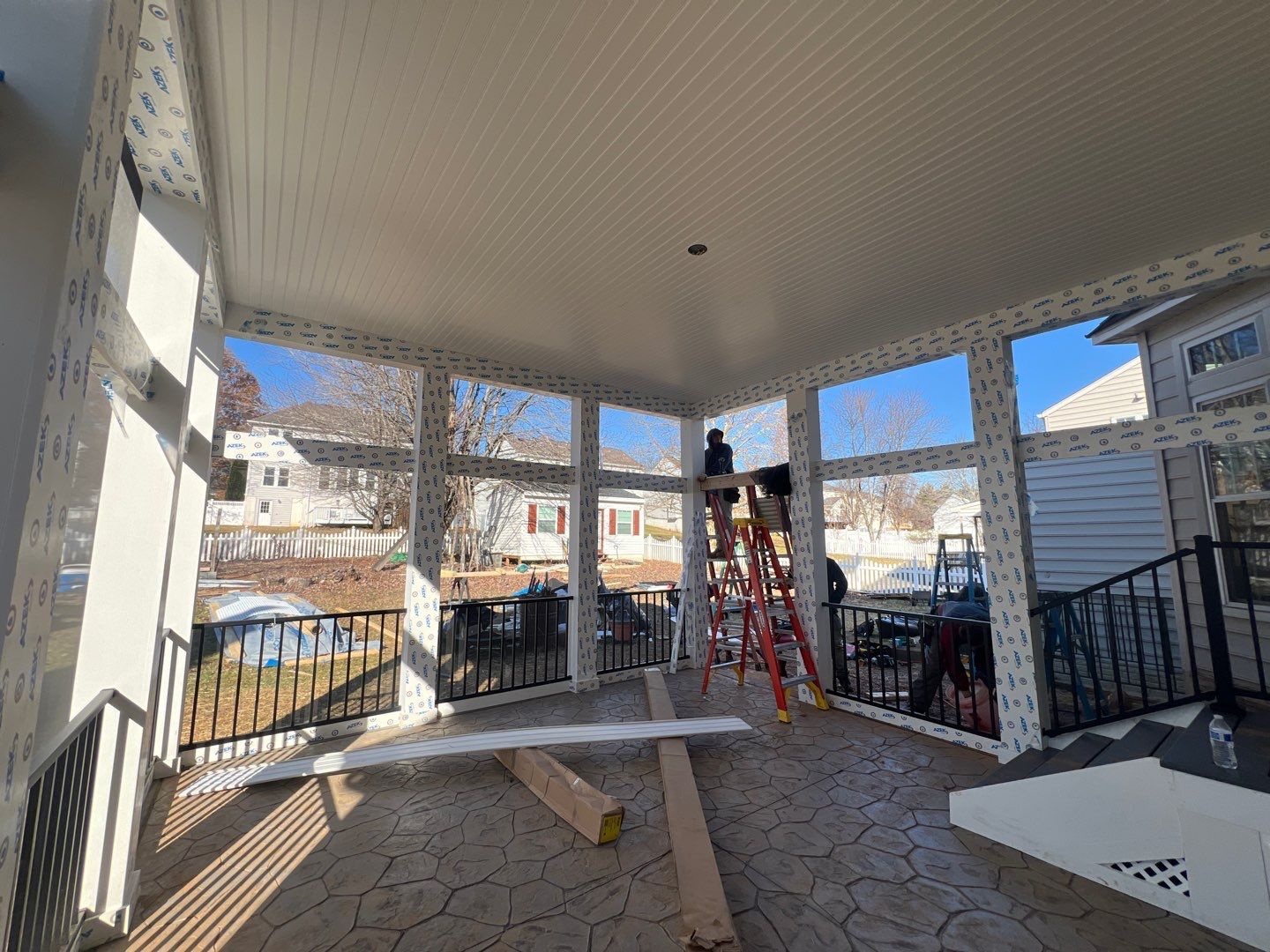 Custom Screened-In Porch with Stamped Concrete Patio in Warrenton by Jakari Restoration & Construction LLC