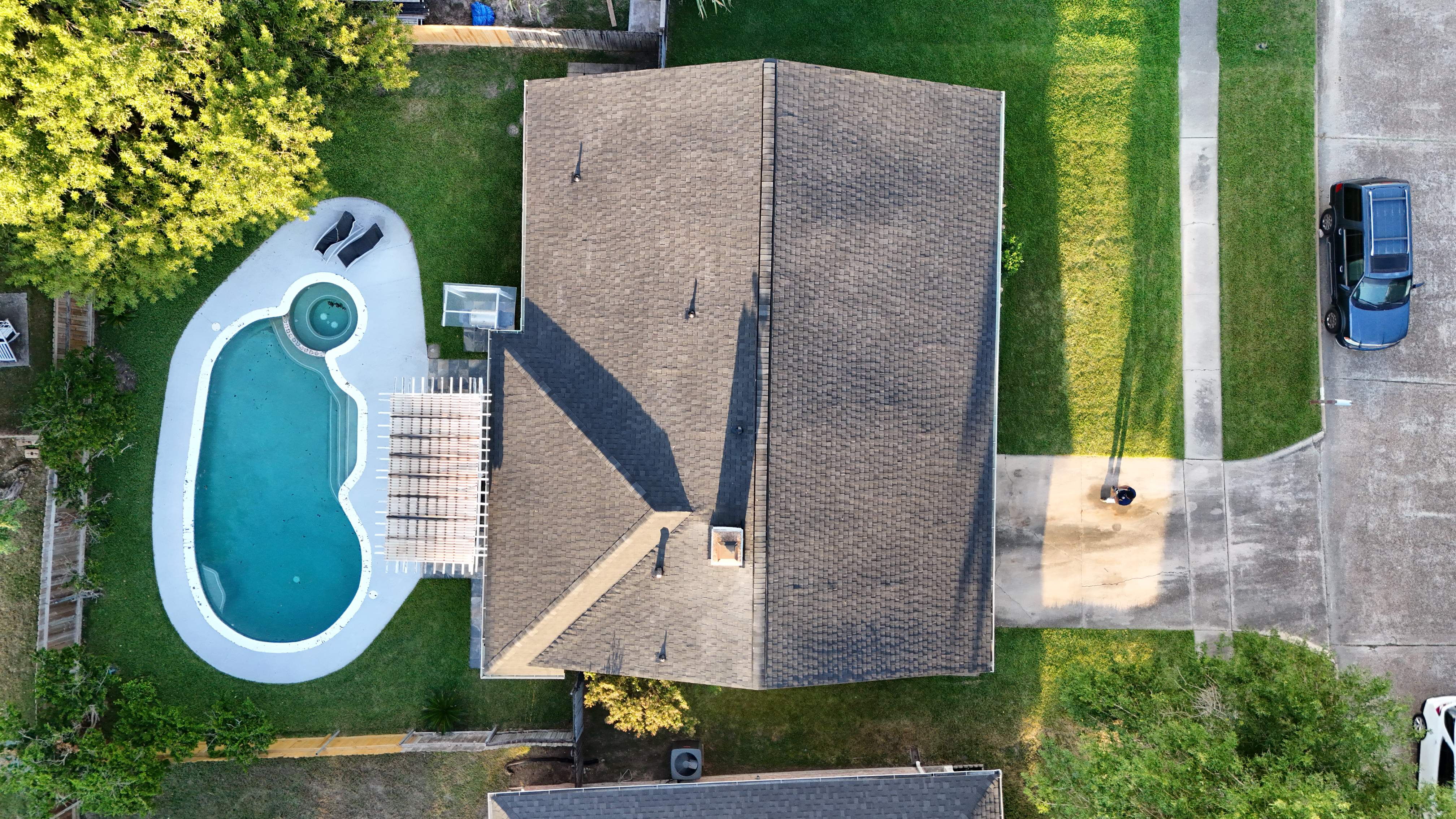 Poolside Roof Replacement in Smoky Gray — Houston, TX by PL Roofing & SB Roofing, LLC.