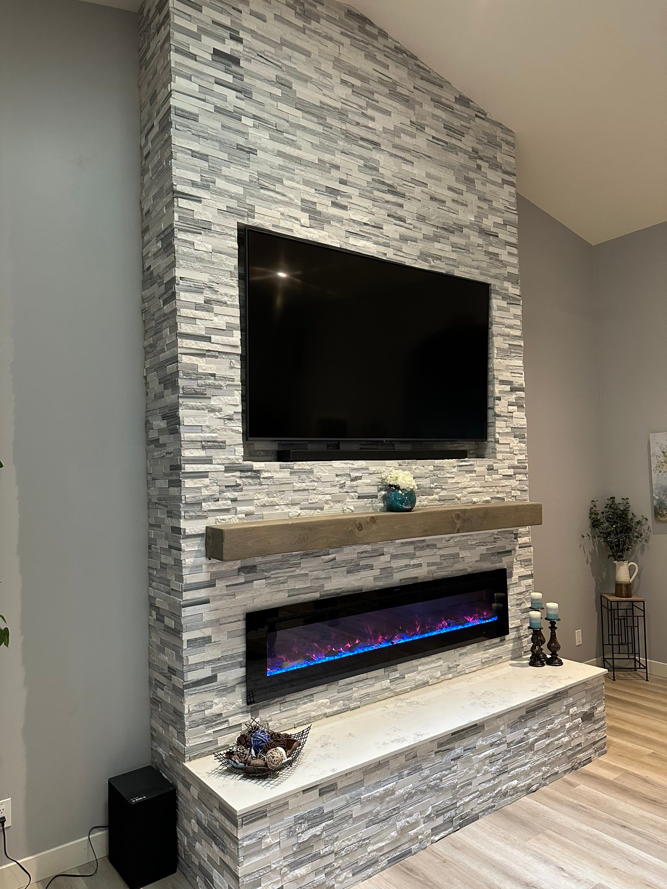 Stacked Stone Electric Fireplace by Footprints Floors of Chandler 