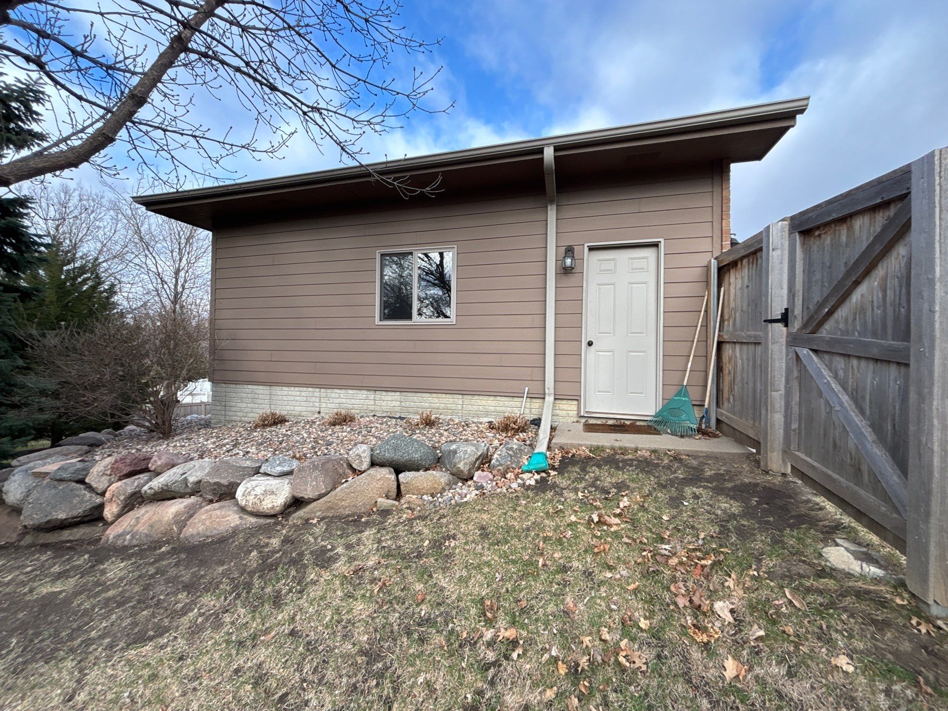 Multi-Story Residential Exterior Painting and Siding Refresh in Sioux Falls by Select Painting, Coatings & Garage Cabinets