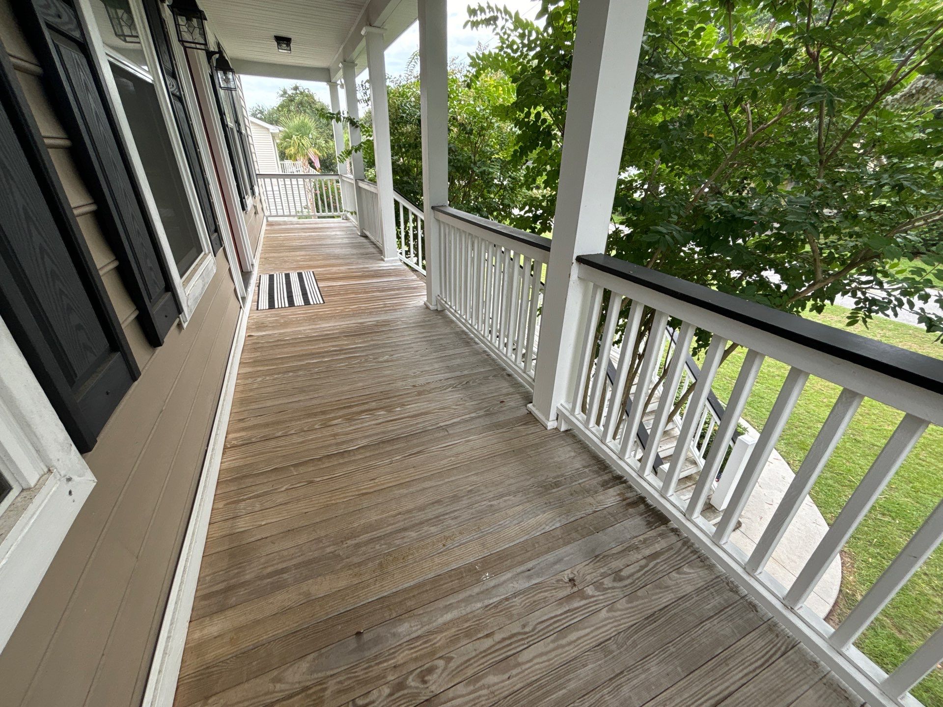 Weathered Deck and Screened Porch using Wood Sealant by DuraSeal
