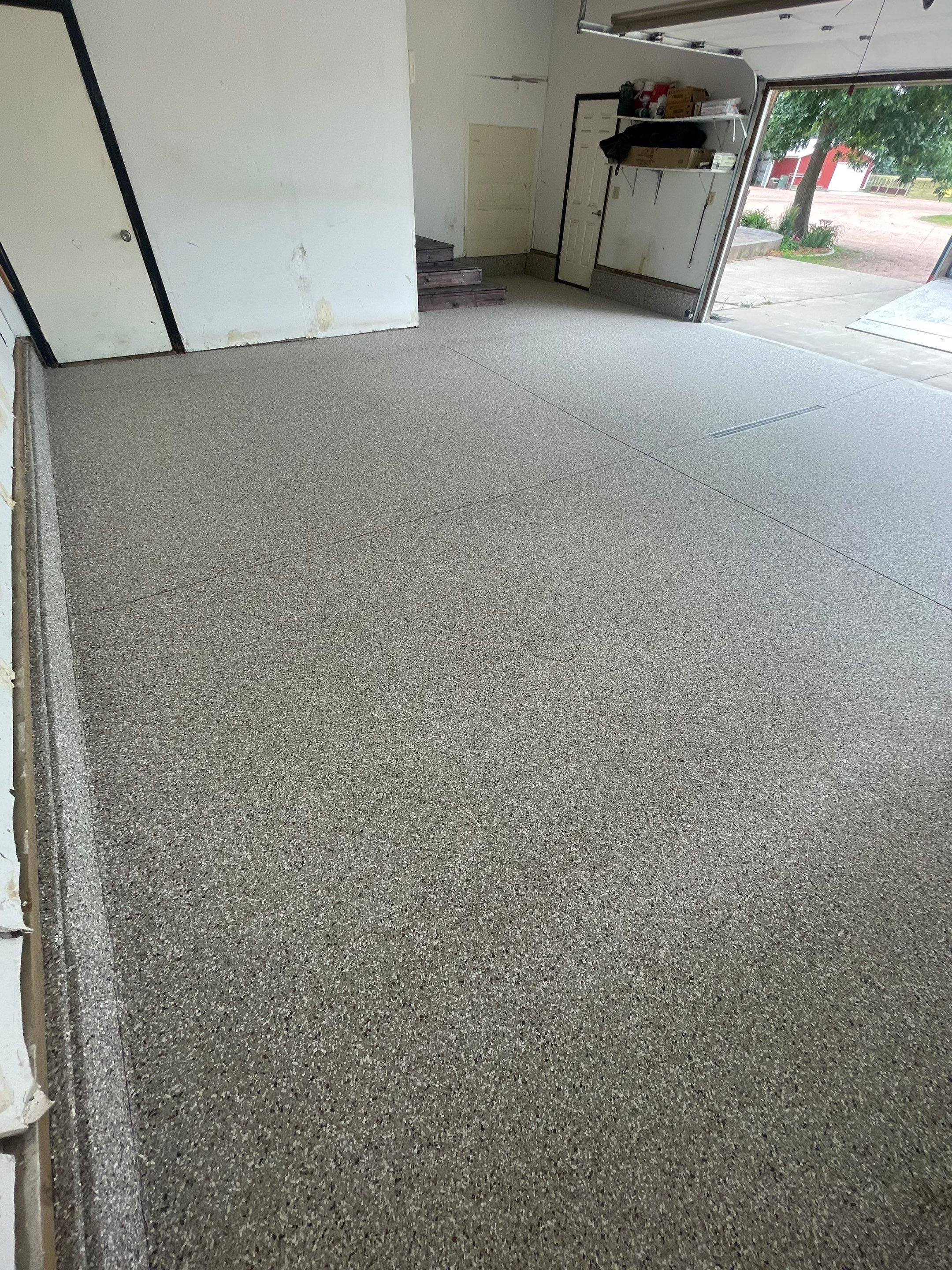 Hartford Residential Garage Floor Transformation With Decorative Chip Coating by Select Painting, Coatings & Garage Cabinets