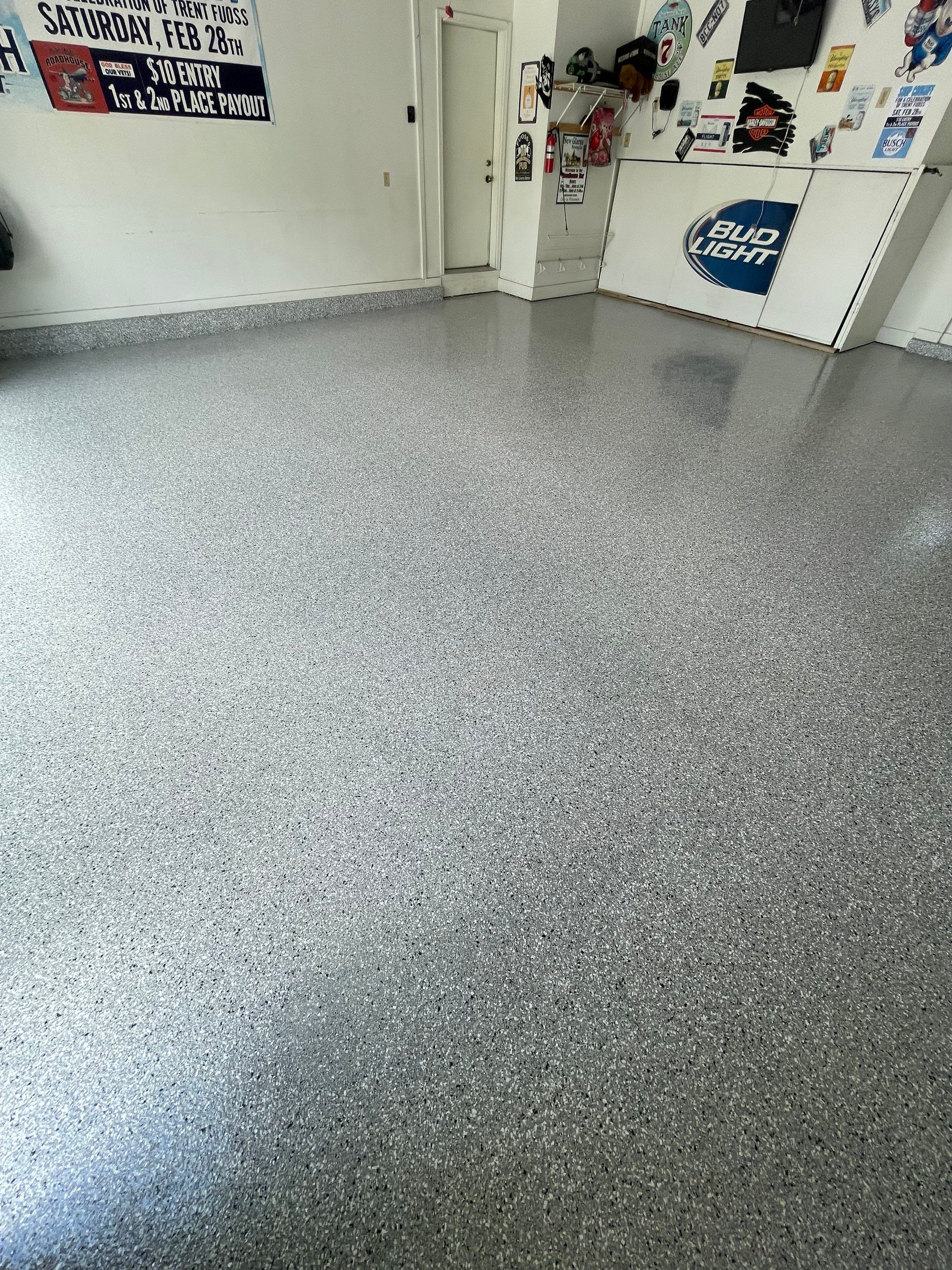 Residential Garage Floor Coating with Feather Grey Finish in Sioux Falls by Select Painting, Coatings & Garage Cabinets