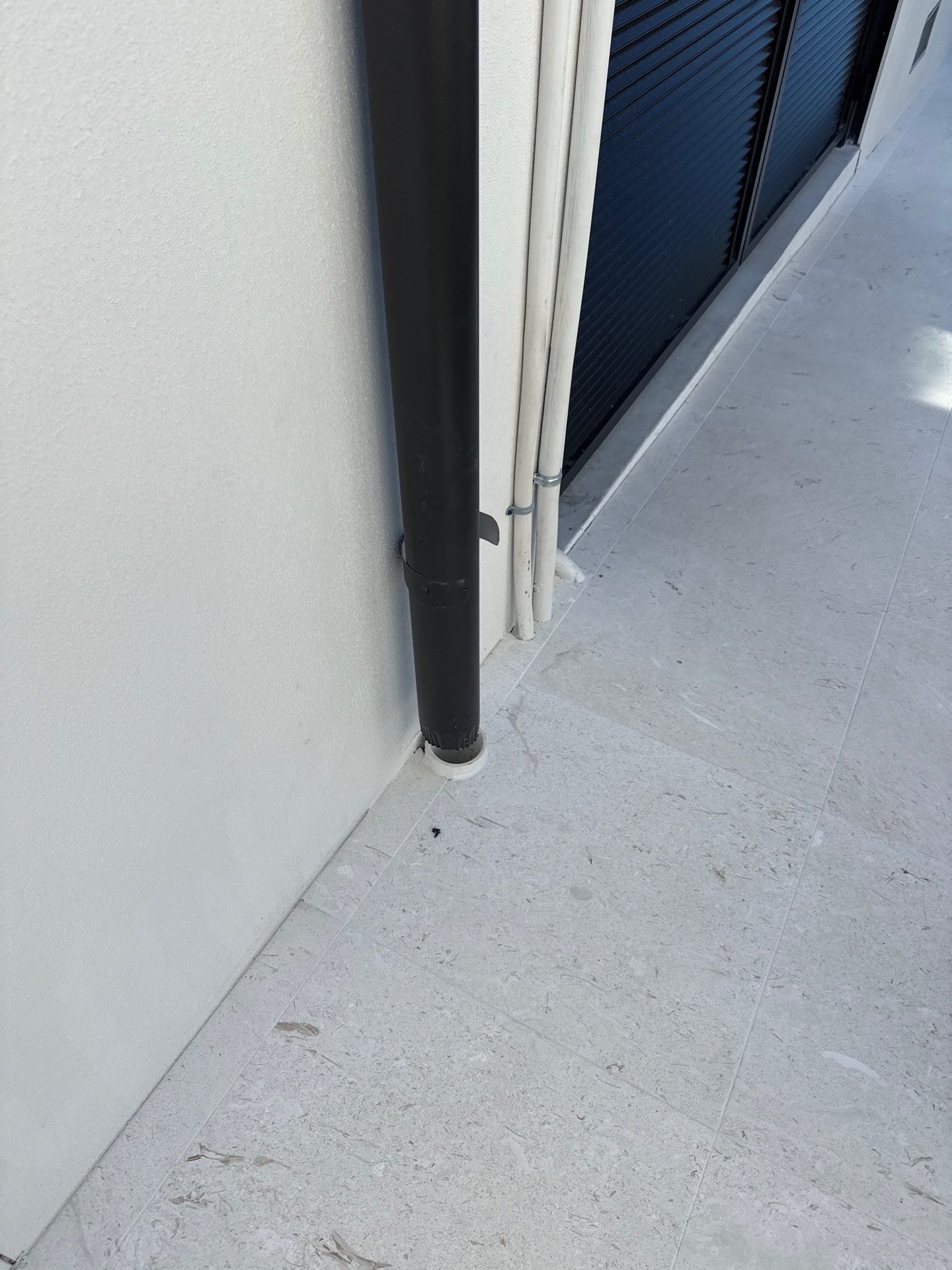 Seamless Aluminum Gutter Installation using black seamless gutters in Sarasota FL by Gutter Professors