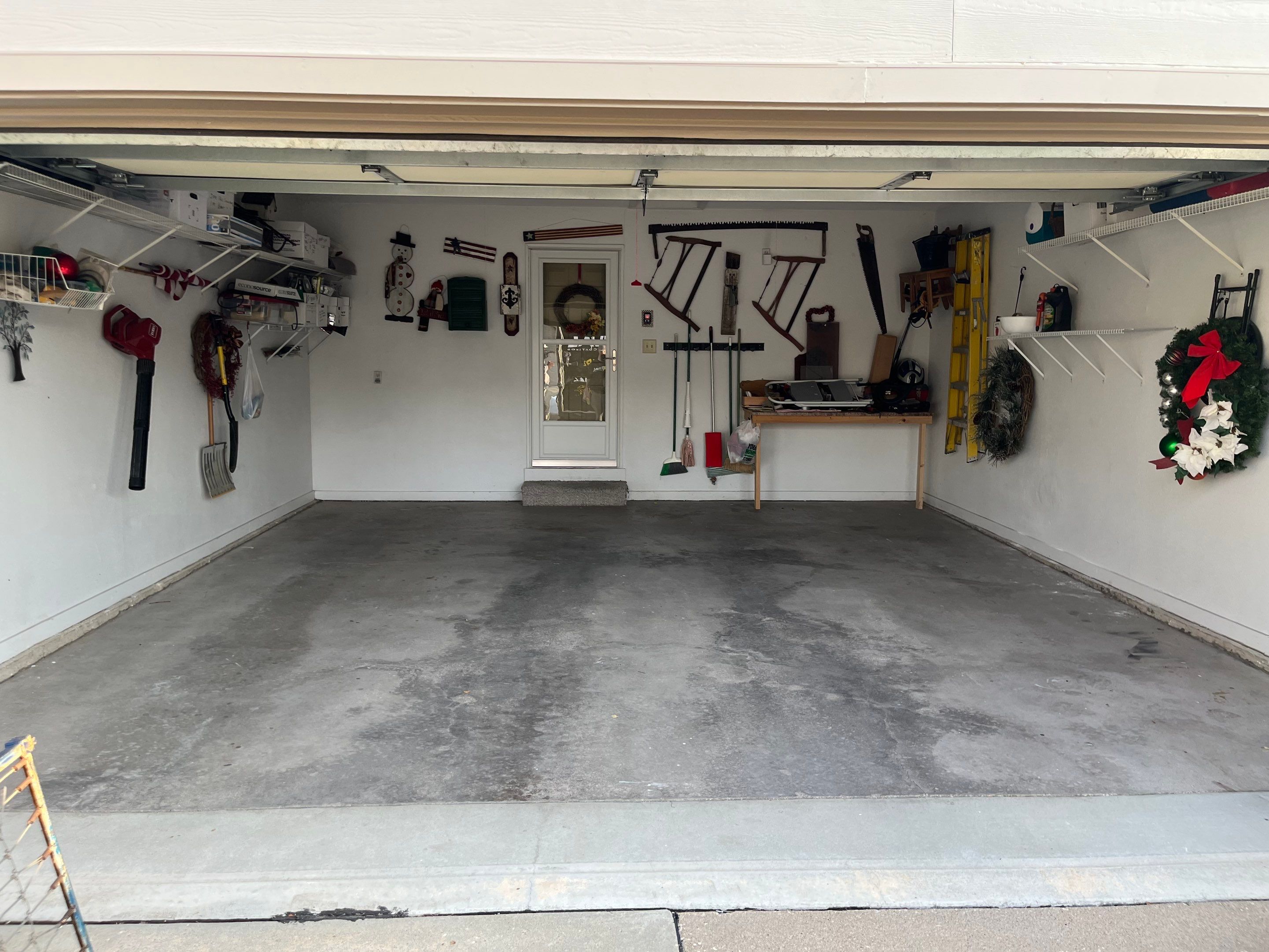 West Des Moines Garage and Patio Floor Coating using Pebble Beach Flakes by Revival Concrete Coatings