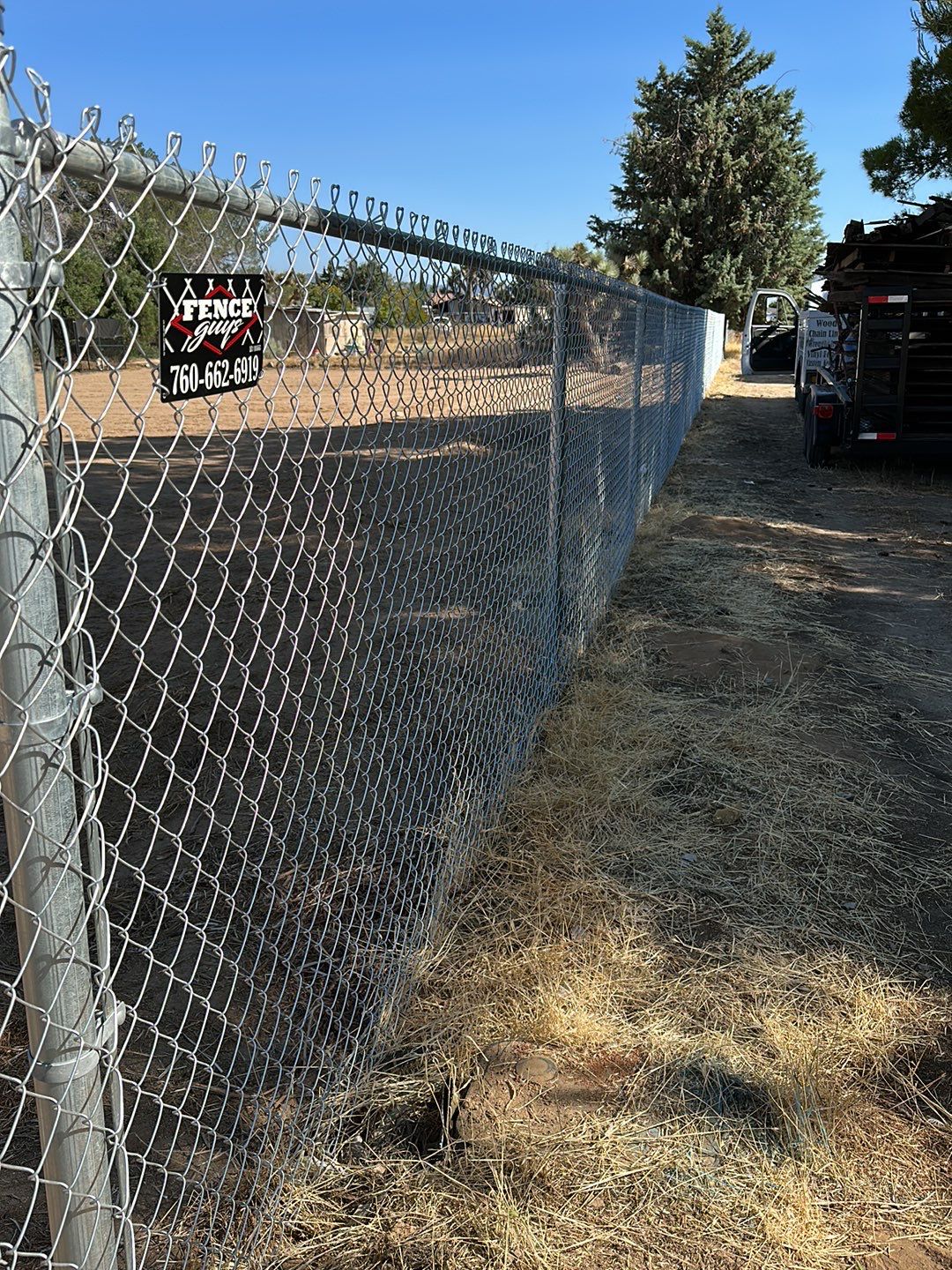 Replaced wood fence with chain link fence.  by Fence Guys Inc. 