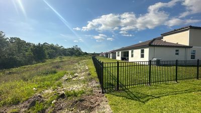 Aluminum Fence Installation using Black 3 Rail Aluminum Fence