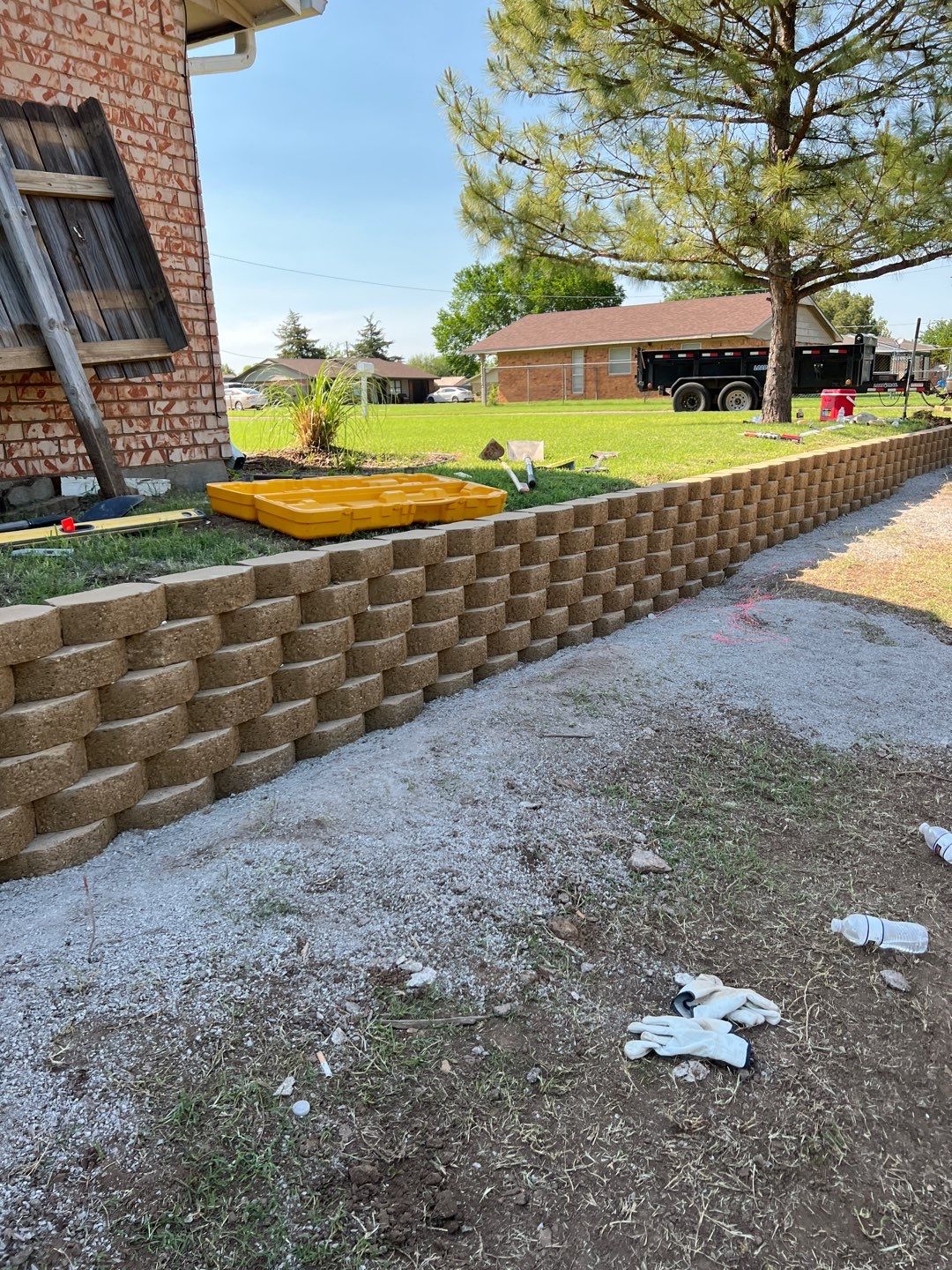 Retaining Wall using Rocks by Clays Services Inc