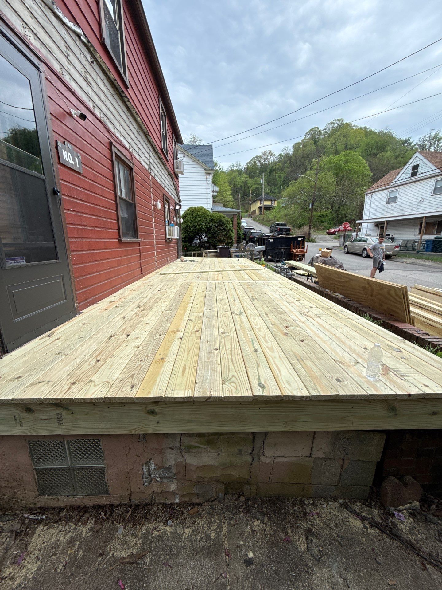 Roof sunspace deck  by Cousins Roofing Siding & Decks