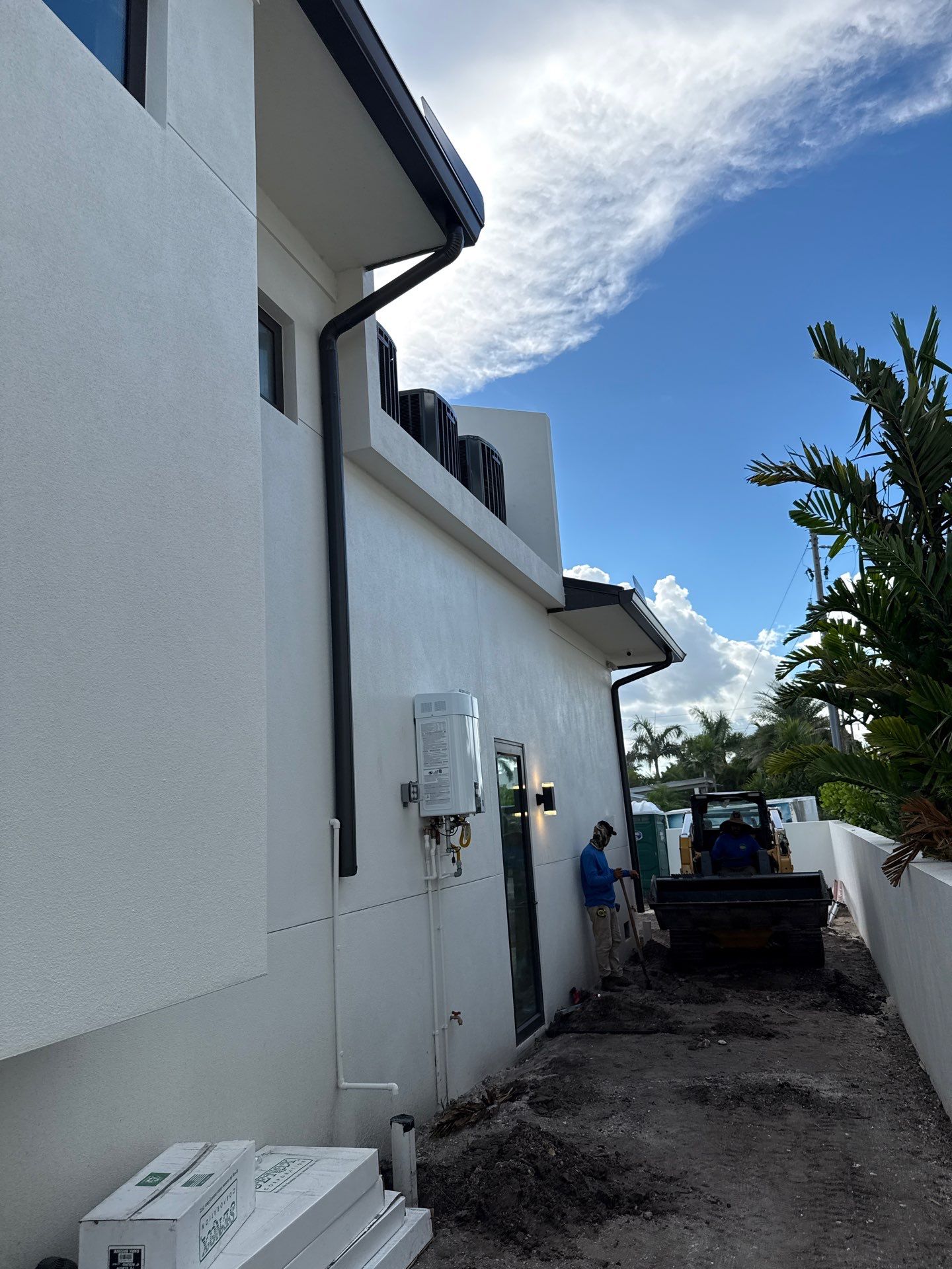 Seamless Aluminum Gutter Installation using black seamless gutters in Sarasota FL by Gutter Professors