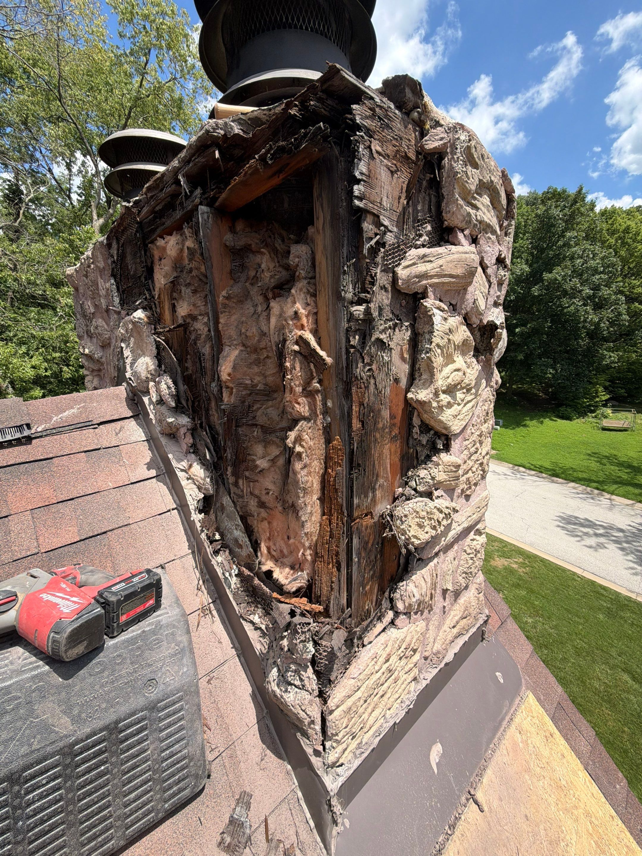 Structural Stone Chimney Restoration and Roof Repair in Leavenworth by Summit Roofing