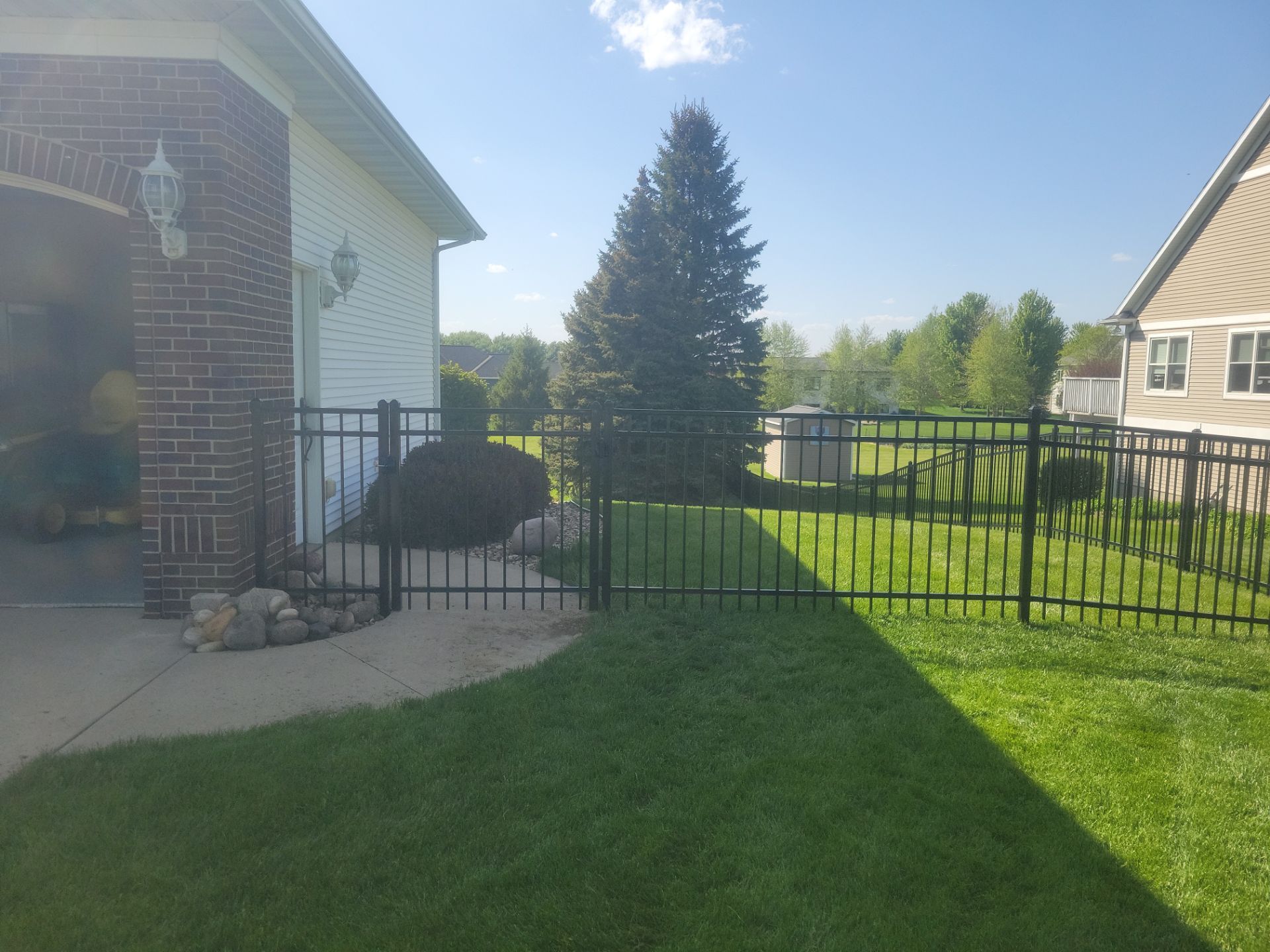 Black Ornamental Metal Picket Fence Installation in Waterloo by Perfect Picket Fence and Stain