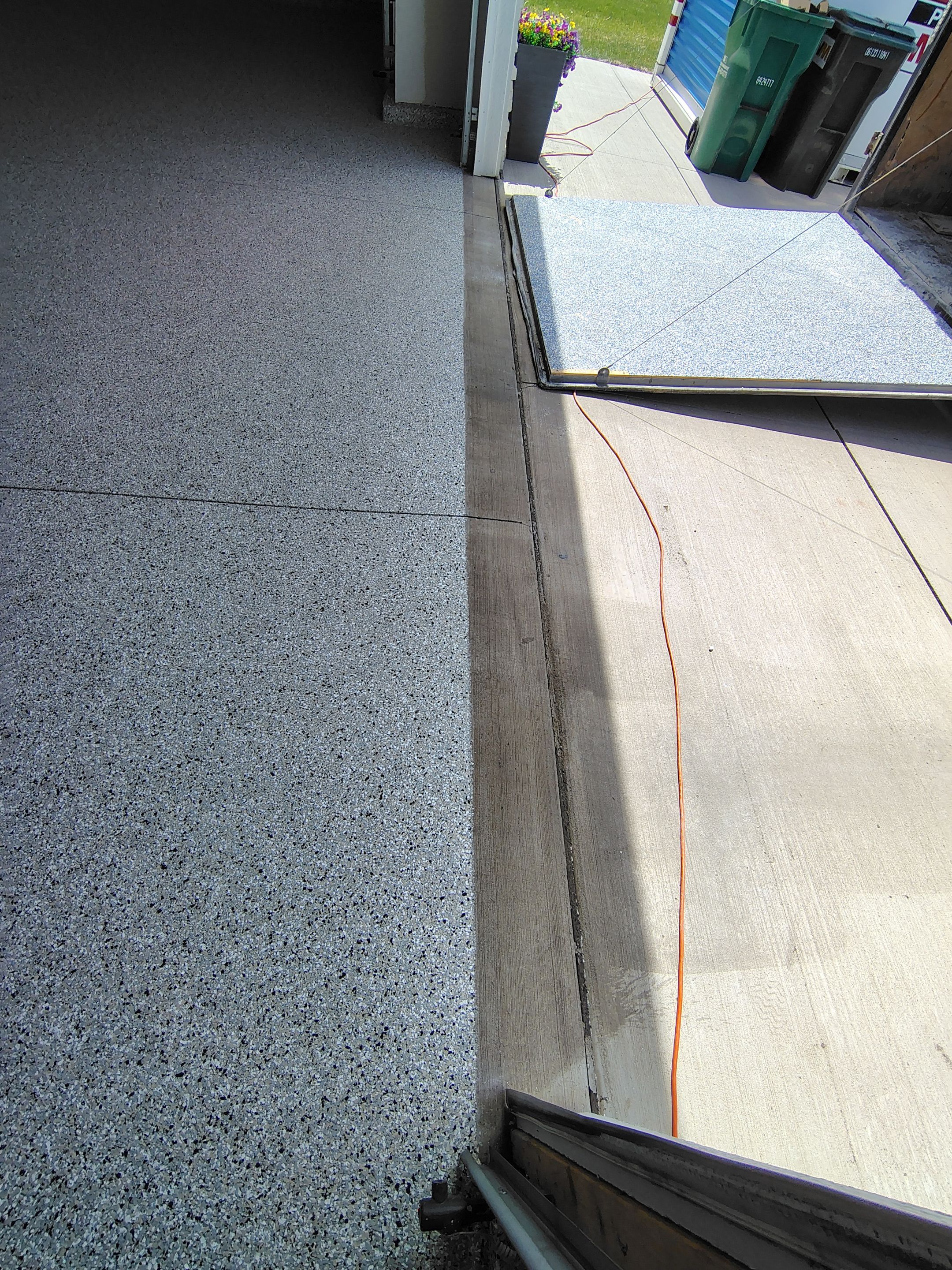 Epoxy Garage Floor Coating with Decorative Flake in Harrisburg by Select Painting, Coatings & Garage Cabinets