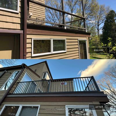 Replacement deck on top of flat roof, Trex Tropical Spiced rum boards and fascia, Trex signature aluminum railings in Black.