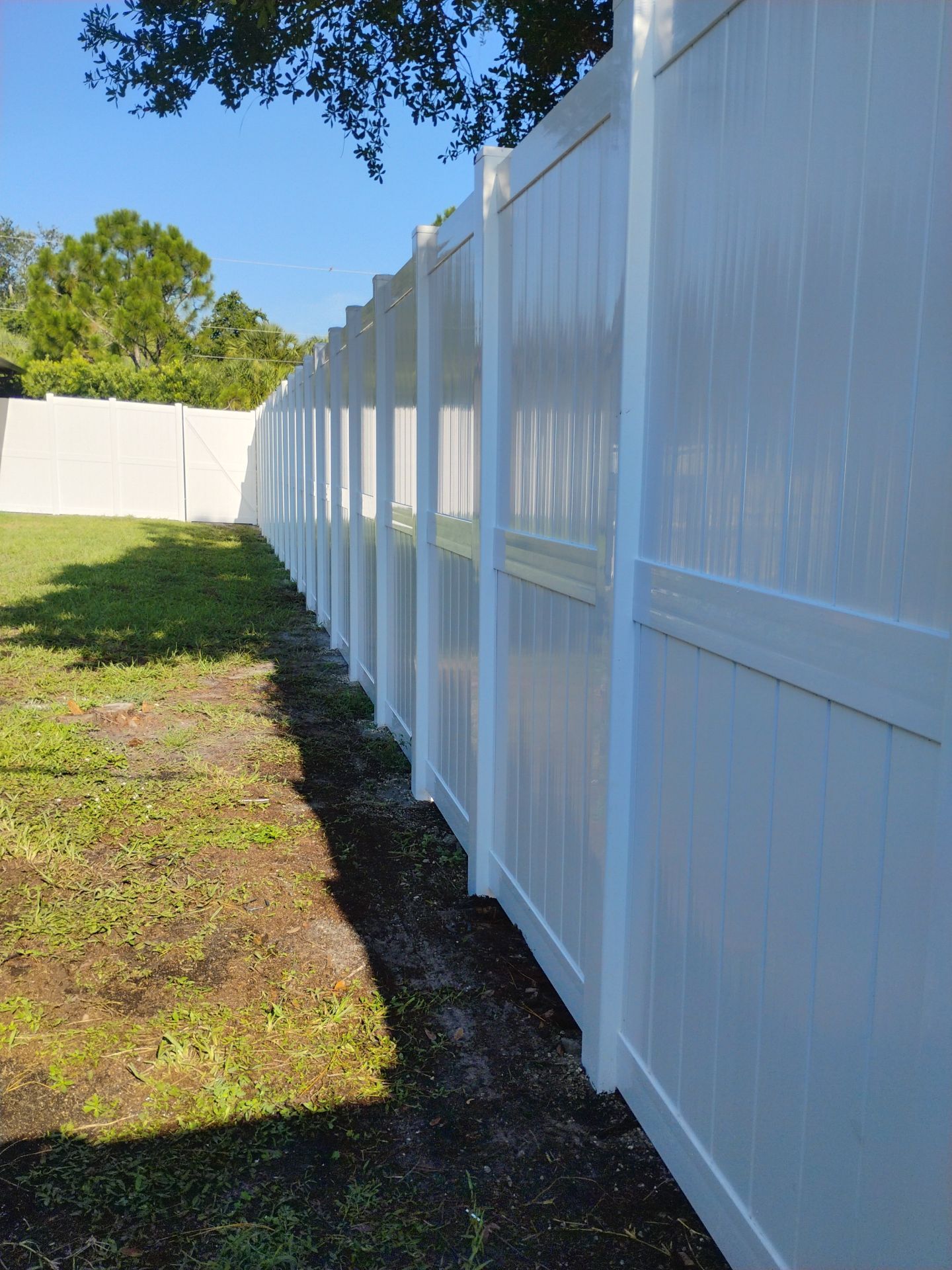 8'H White Vinyl Privacy Fence Installation in North Port by True Fence LLC