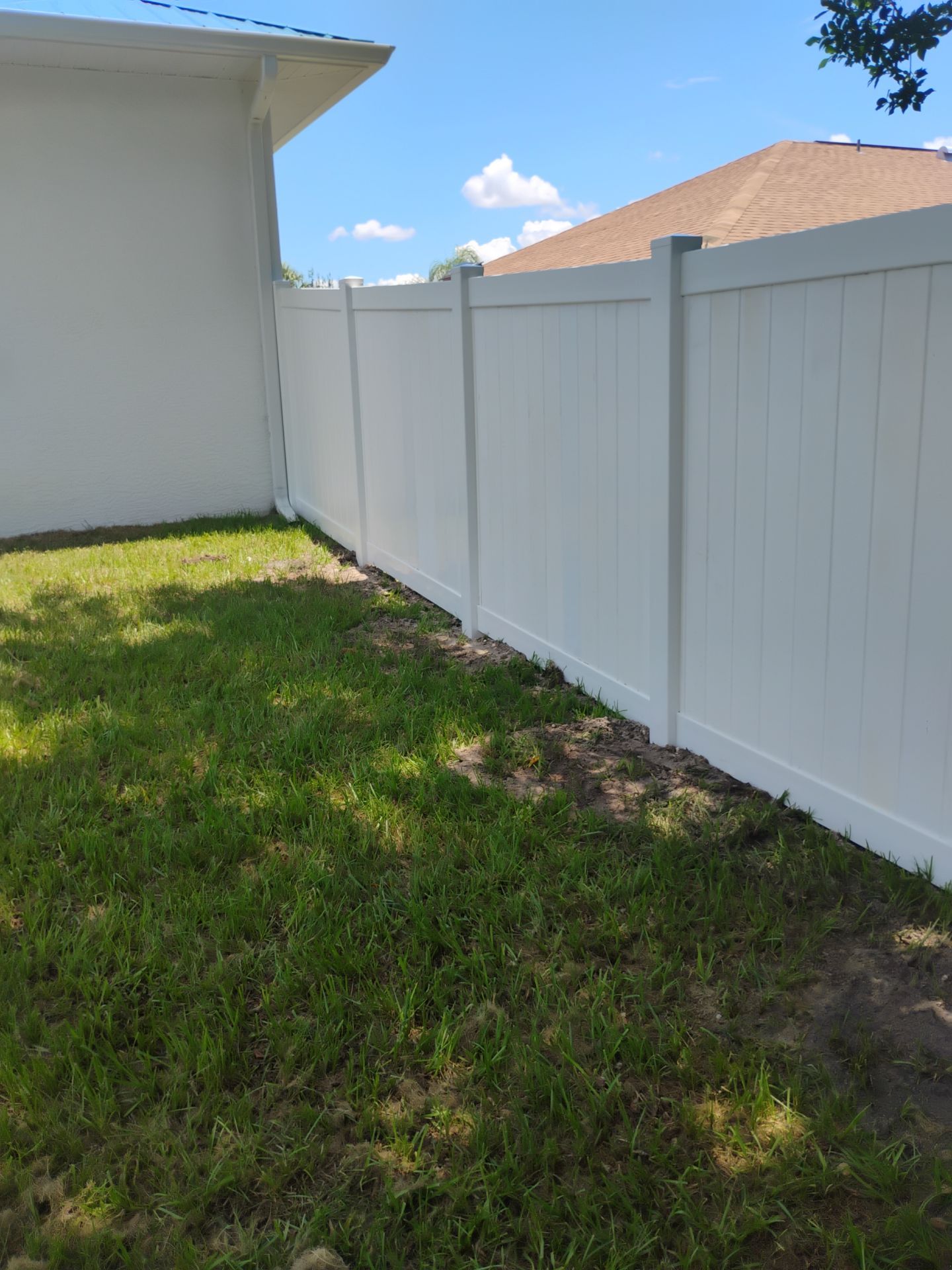 White Vinyl Privacy Fence Installation and Gate Repair in Port Charlotte by True Fence LLC