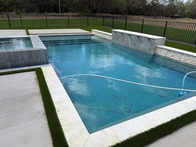 Modern Geometric Pool with Raised Spa and Tanning Ledge