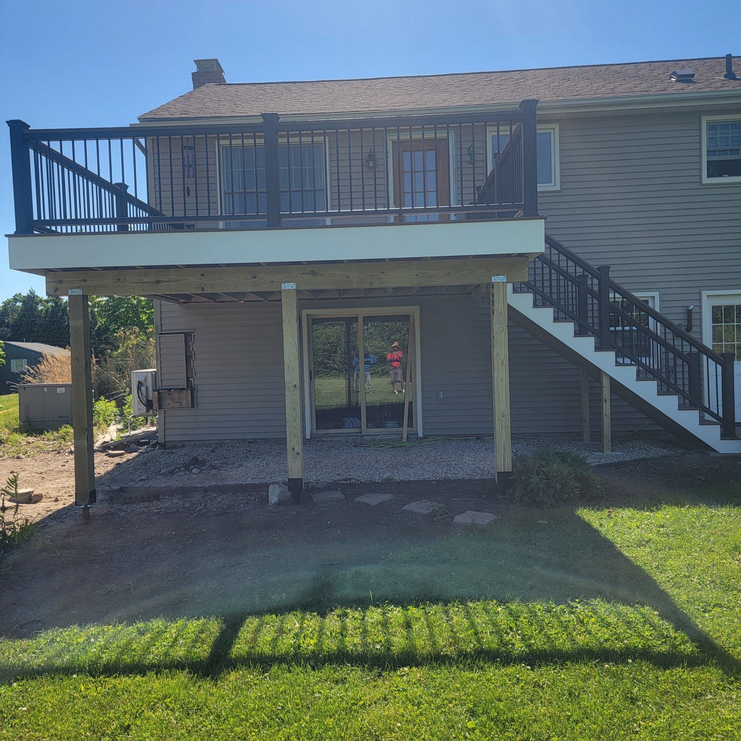 Deck Replacement using Trex Tropical Havana Gold and matching transcend cocktail railing.  by DiGiorgi Roofing and Siding Inc