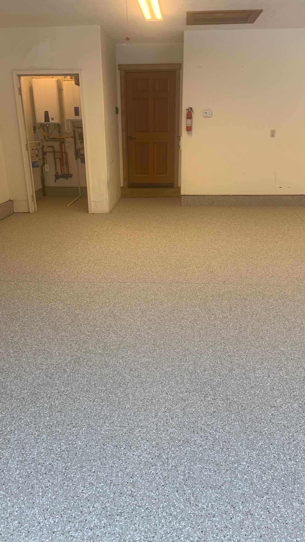 Garage Transformation using Pebble Beach by Croc Coatings, LLC