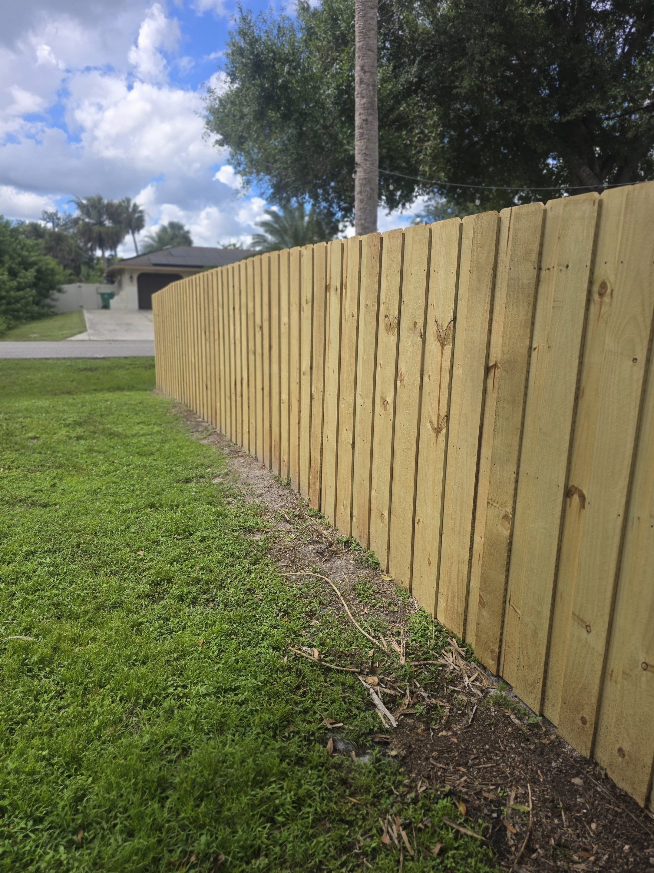 Wood Privacy Fence Installation with Double Gate in Port Charlotte by True Fence LLC