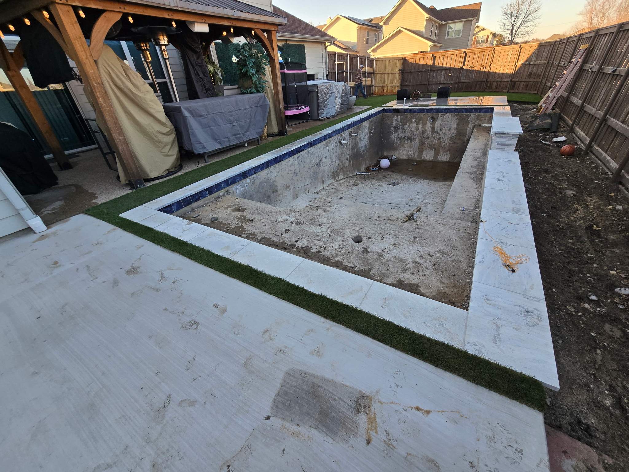 Pool with Turf and Raised Wall by Pinnacle Pools and Spas - DFW