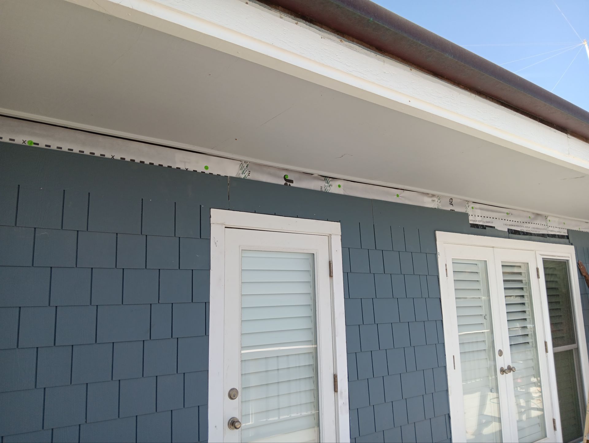 Pre-finish shingles by New Era Siding Inc 